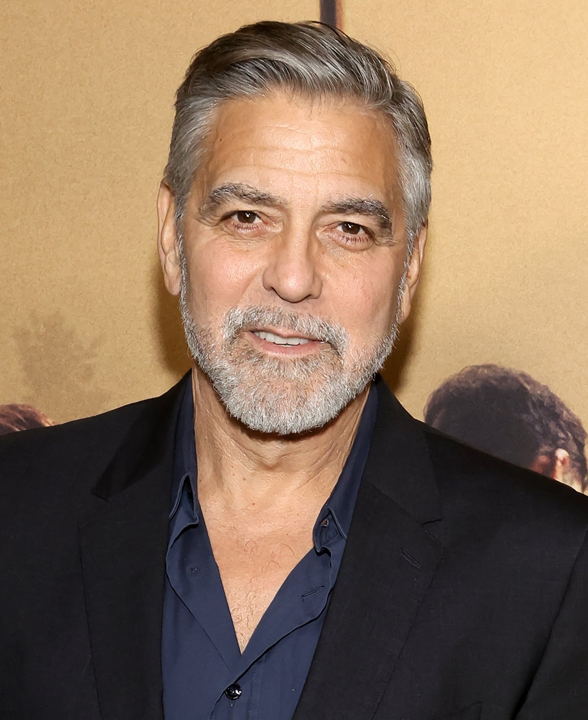 Timeless charm: George Clooney's silver hair and salt-and-pepper beard at the premiere night