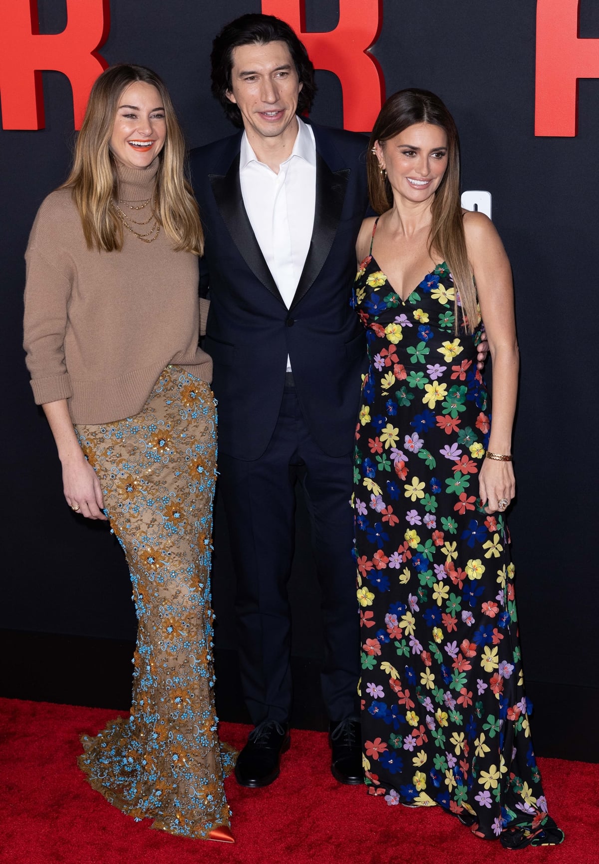 Penélope Cruz alongside Adam Driver and Shailene Woodley, showcasing their respective Chanel, navy tuxedo, and Valentino ensembles at the 'Ferrari' premiere