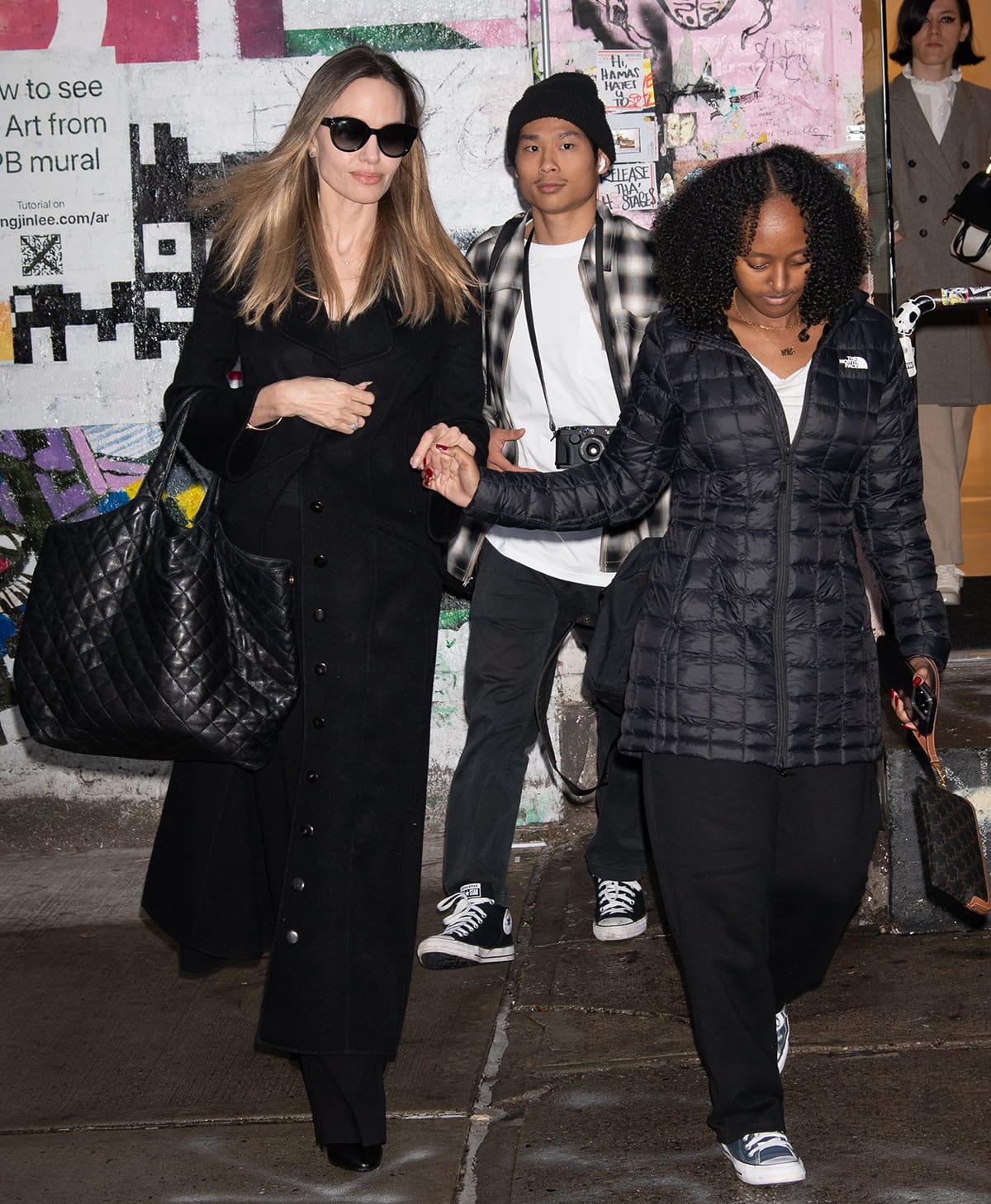 Angelina Jolie, son Pax, and daughter Zahara visit Atelier Jolie in casual winter outfits on December 27, 2023