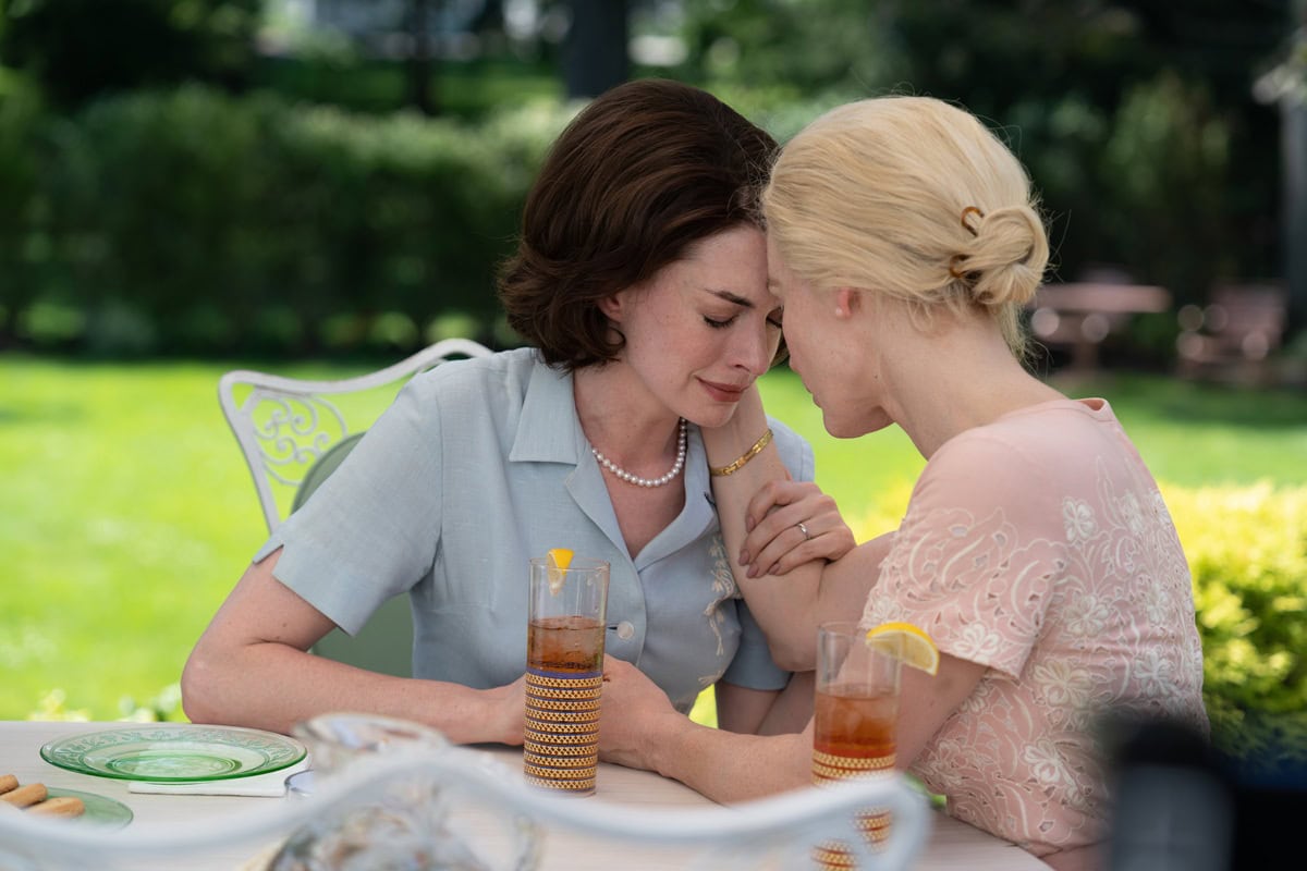 Anne Hathaway wears a powder blue Celine blouse and pearl necklace, while Jessica Chastain stuns in a blush pink embroidered dress as Alice in Mothers' Instinct