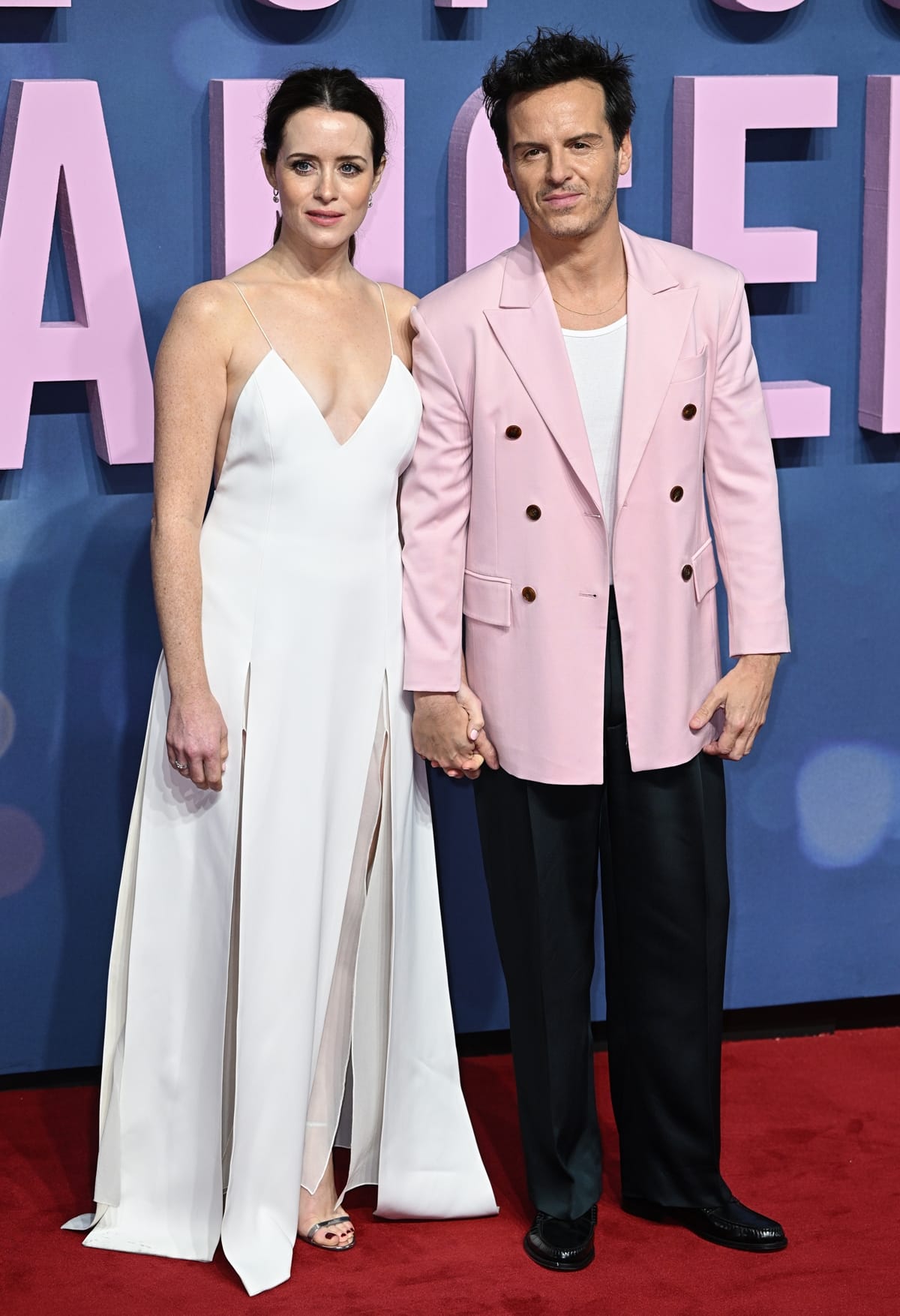 Claire Foy and Andrew Scott, a captivating duo, hold hands on the red carpet at the All of Us Strangers UK Gala Screening