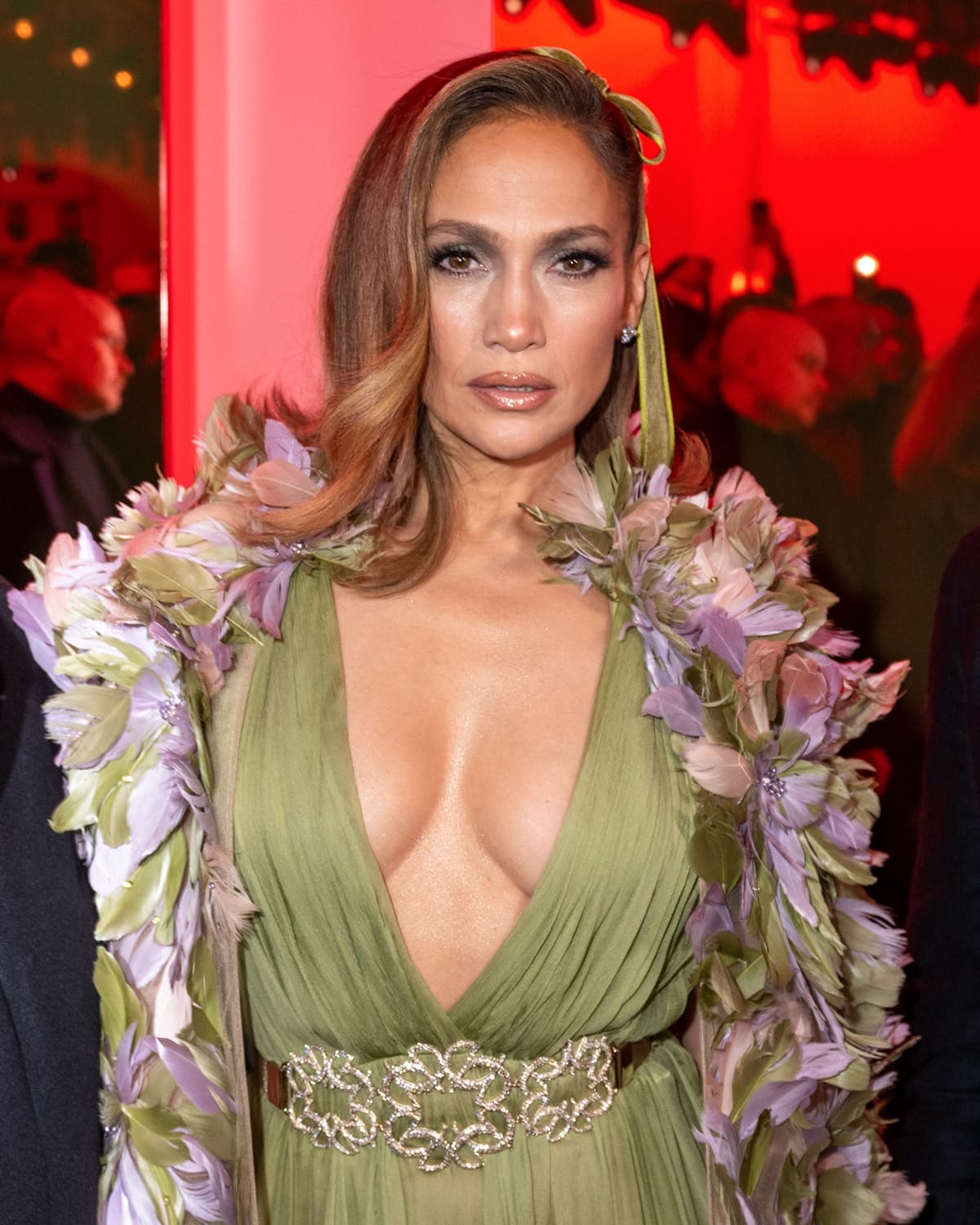 In a breathtaking Elie Saab light green gown adorned with a floral cape, Jennifer Lopez captivates the audience, blending Greek goddess elegance with a touch of whimsical charm