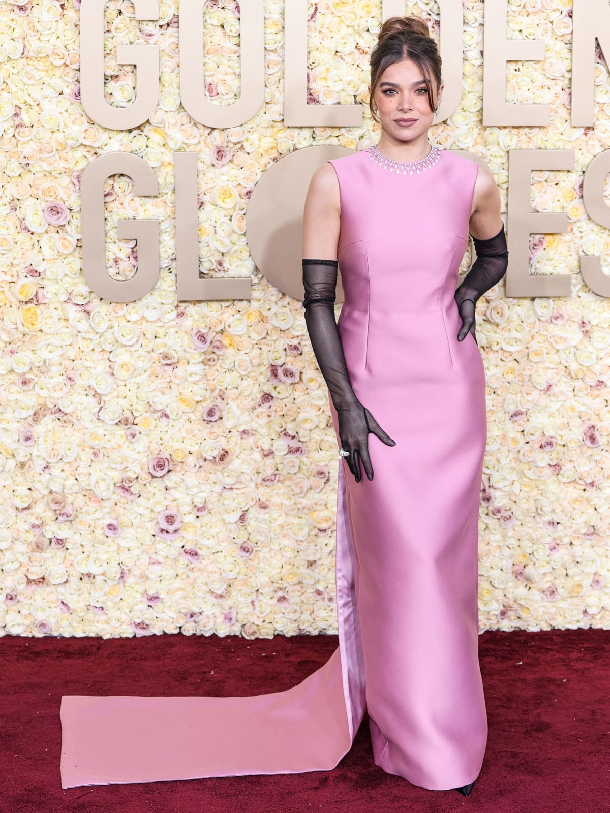 Hailee Steinfeld mesmerized in a custom Prada pink satin gown, blending Audrey Hepburn-inspired classic glamour with contemporary chic at the 81st Annual Golden Globe Awards at The Beverly Hilton on January 7, 2024 in Beverly Hills, California