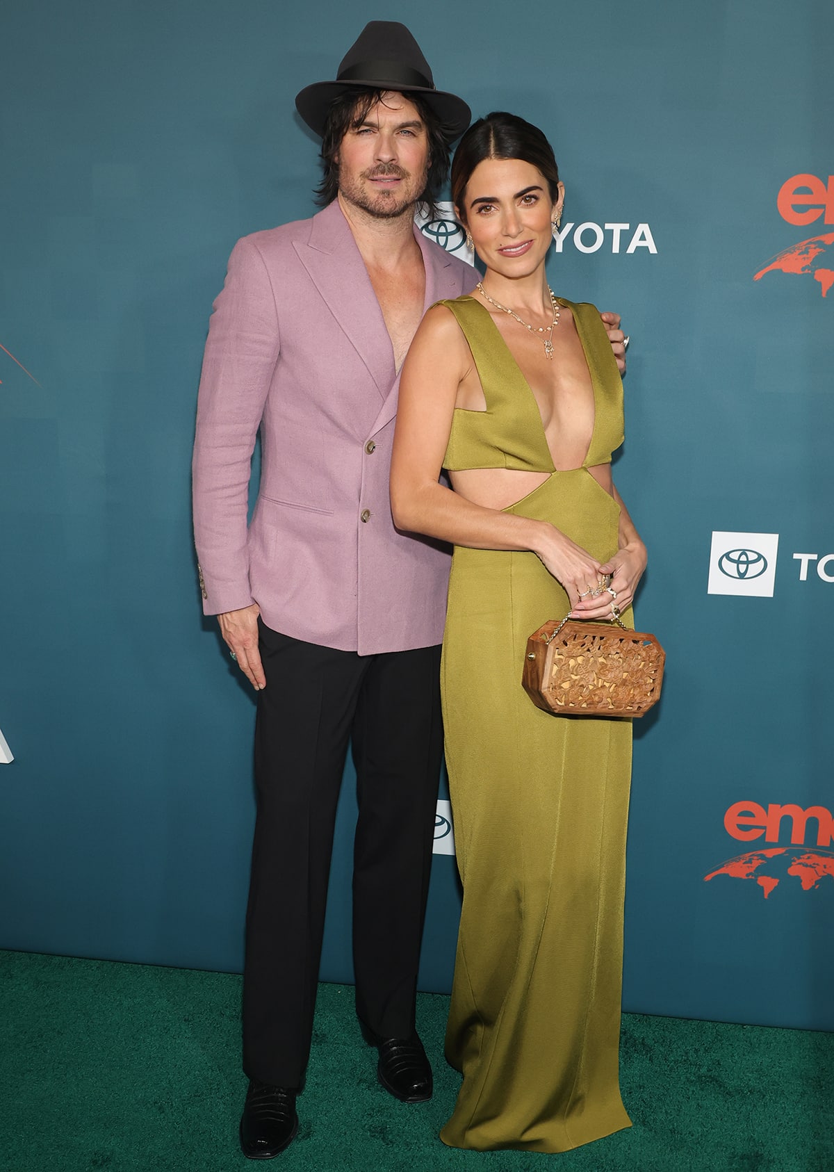 Ian Somerhalder embraces the shirtless trend underneath a lilac blazer while Nikki Reed steals the show in a plunging green gown