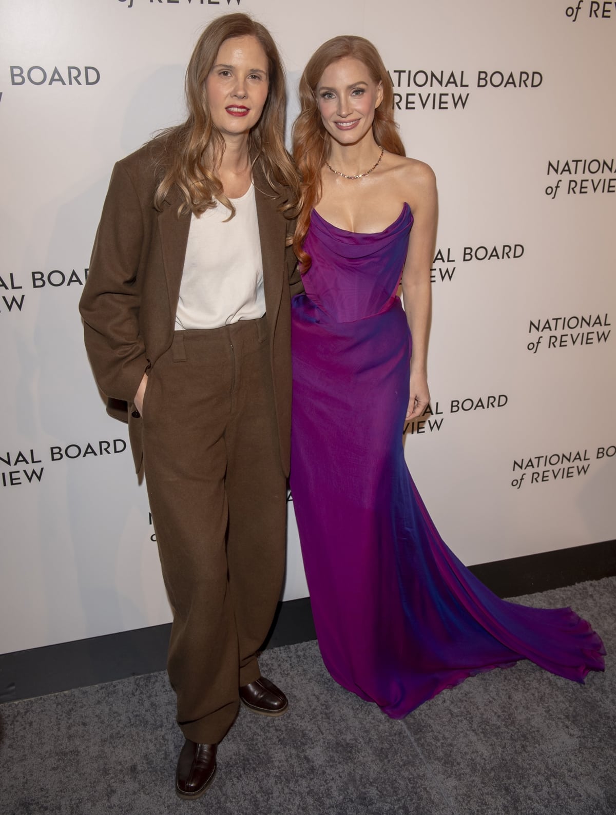 Justine Triet kept it effortlessly cool in a relaxed brown suit and leather loafers, while Jessica Chastain stunned in a strapless purple Vivienne Westwood gown with a scalloped train at the 2024 National Board of Review Awards Gala at Cipriani 42nd Street in New York City