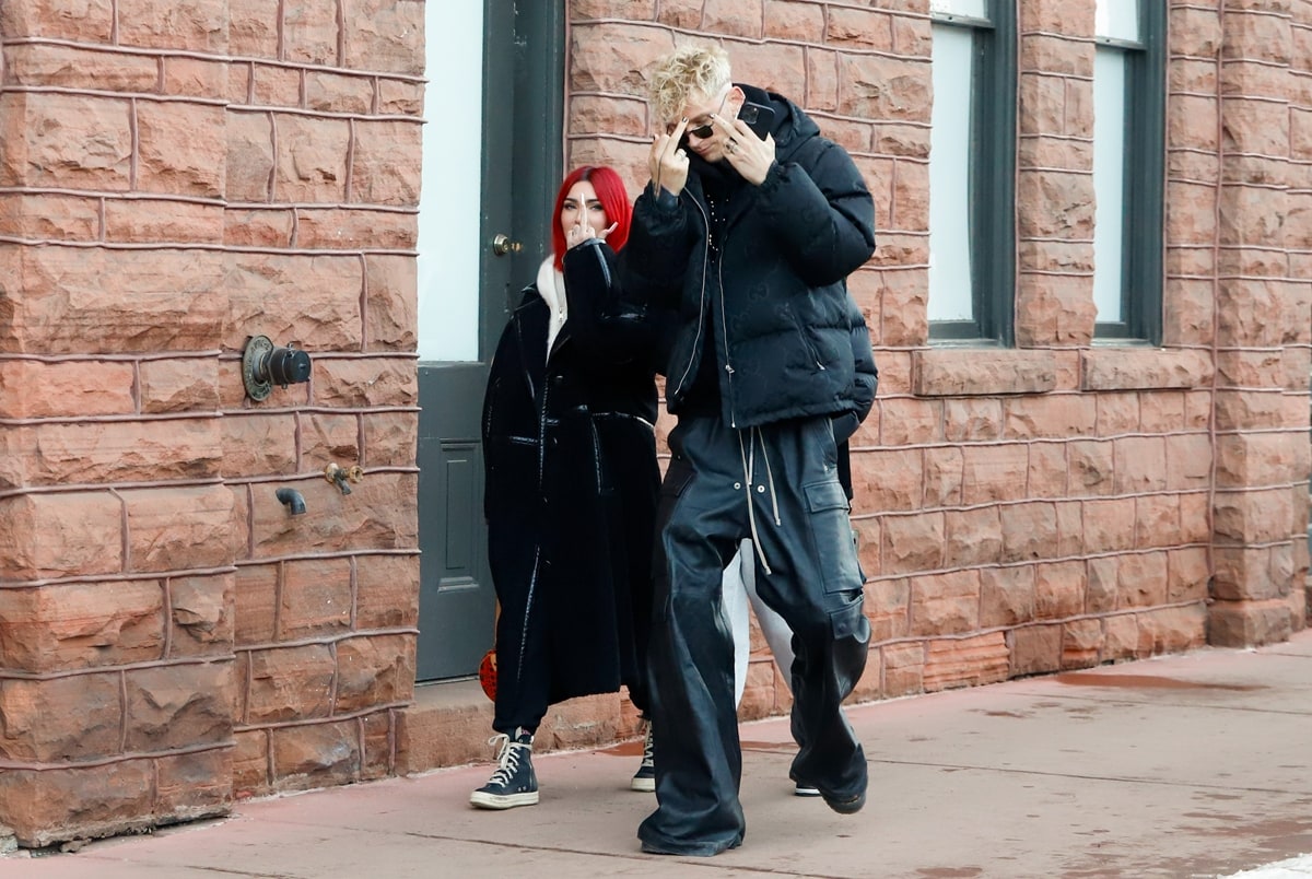 Fashionable New Year's Getaway: Megan Fox and MGK turn the Aspen streets into their runway, showcasing winter style with a touch of Hollywood glamour on December 31, 2023