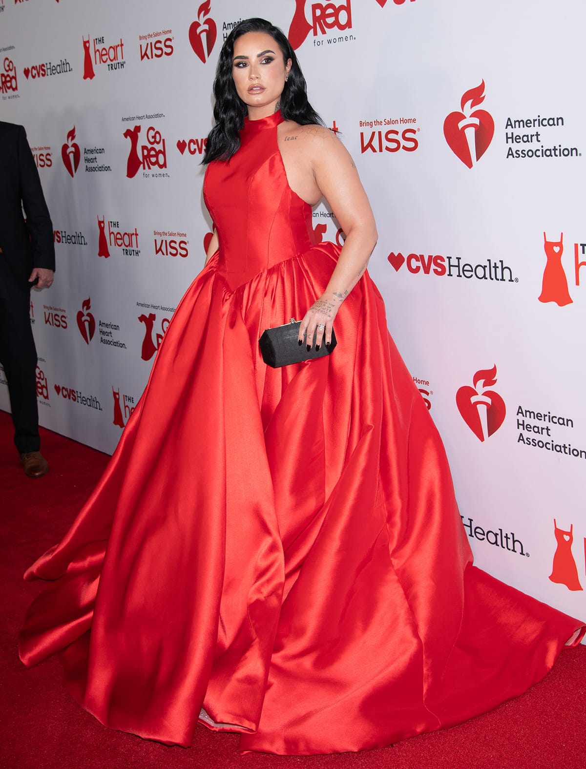 Demi Lovato channels her inner princess in a classic red ballgown with a Basque waistline and a pannier by Taiwan-based label Nicole + Felicia