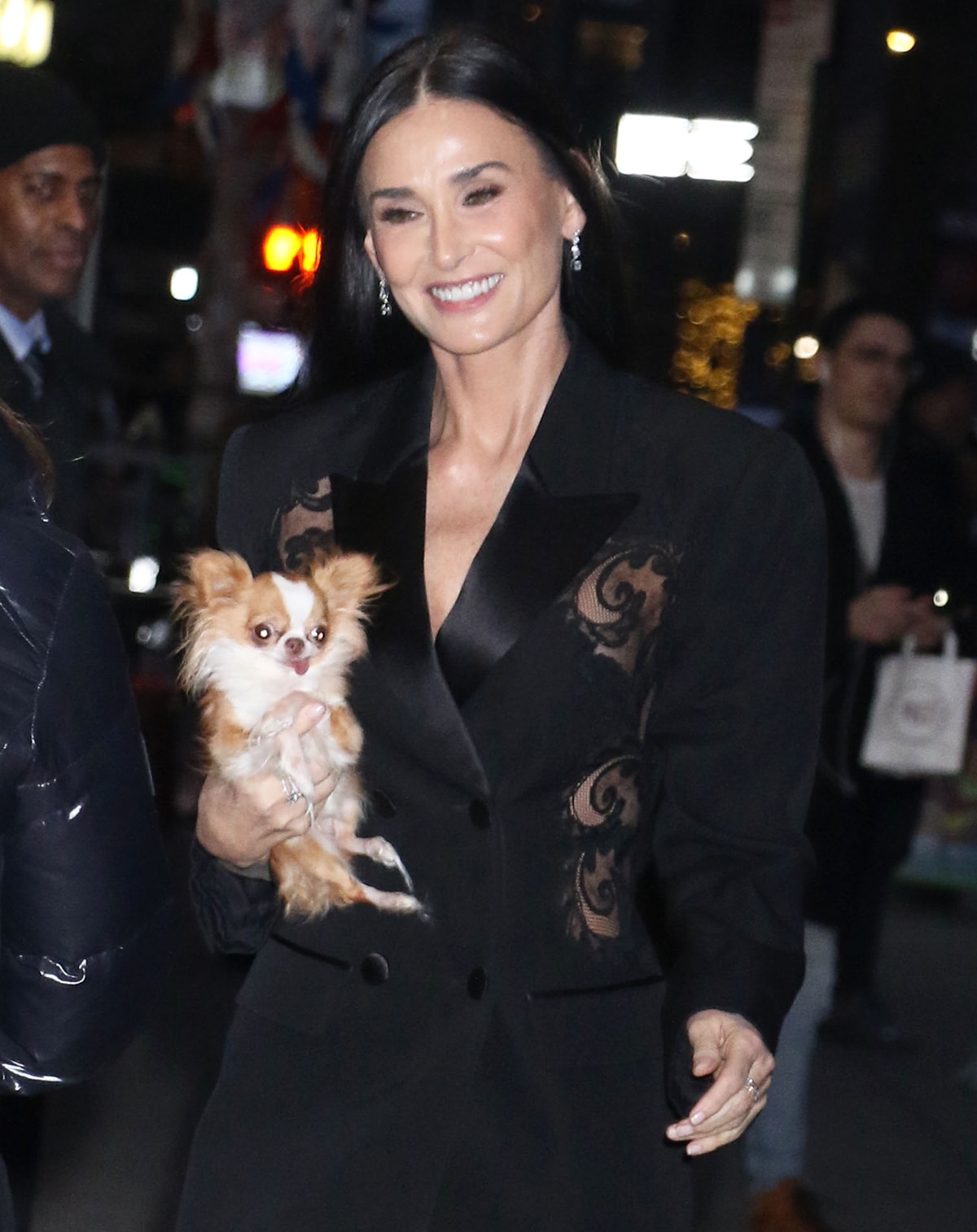 Demi Moore, with her furry companion Pilaf, looks sleek with straightened hair and radiant makeup