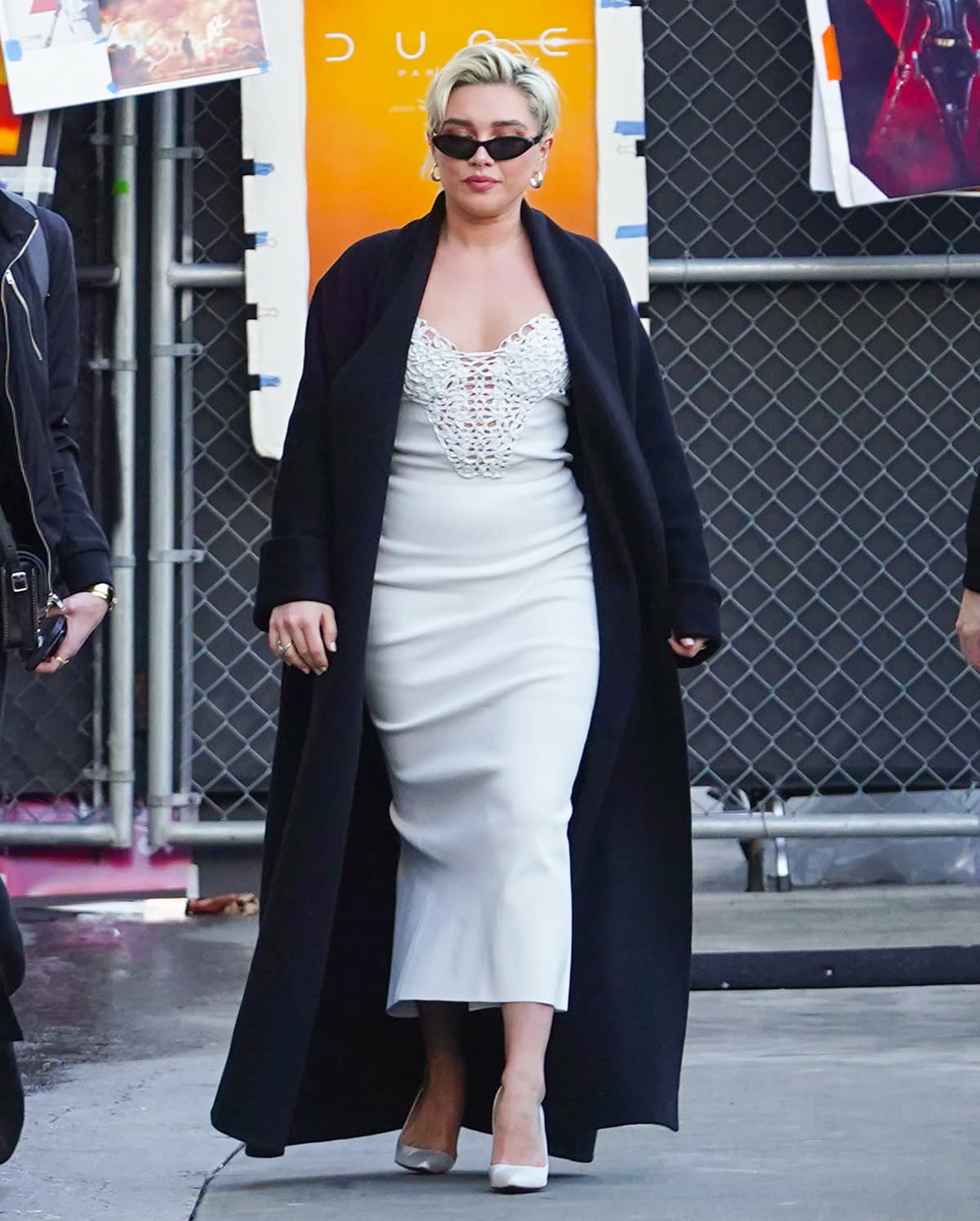 Florence Pugh promotes her new movie Dune: Part Two in a white embroidered-corset jersey midi dress by Galvan at Jimmy Kimmel Live! on February 1, 2024