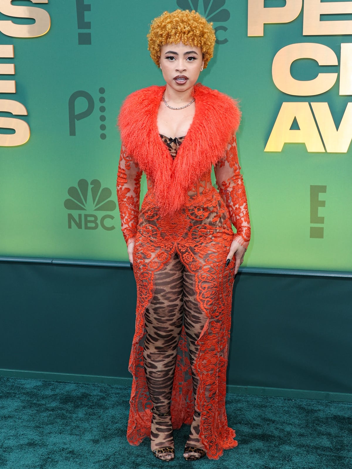 Ice Spice captivates at the 2024 People's Choice Awards in a bespoke Dolce & Gabbana sheer orange coatdress