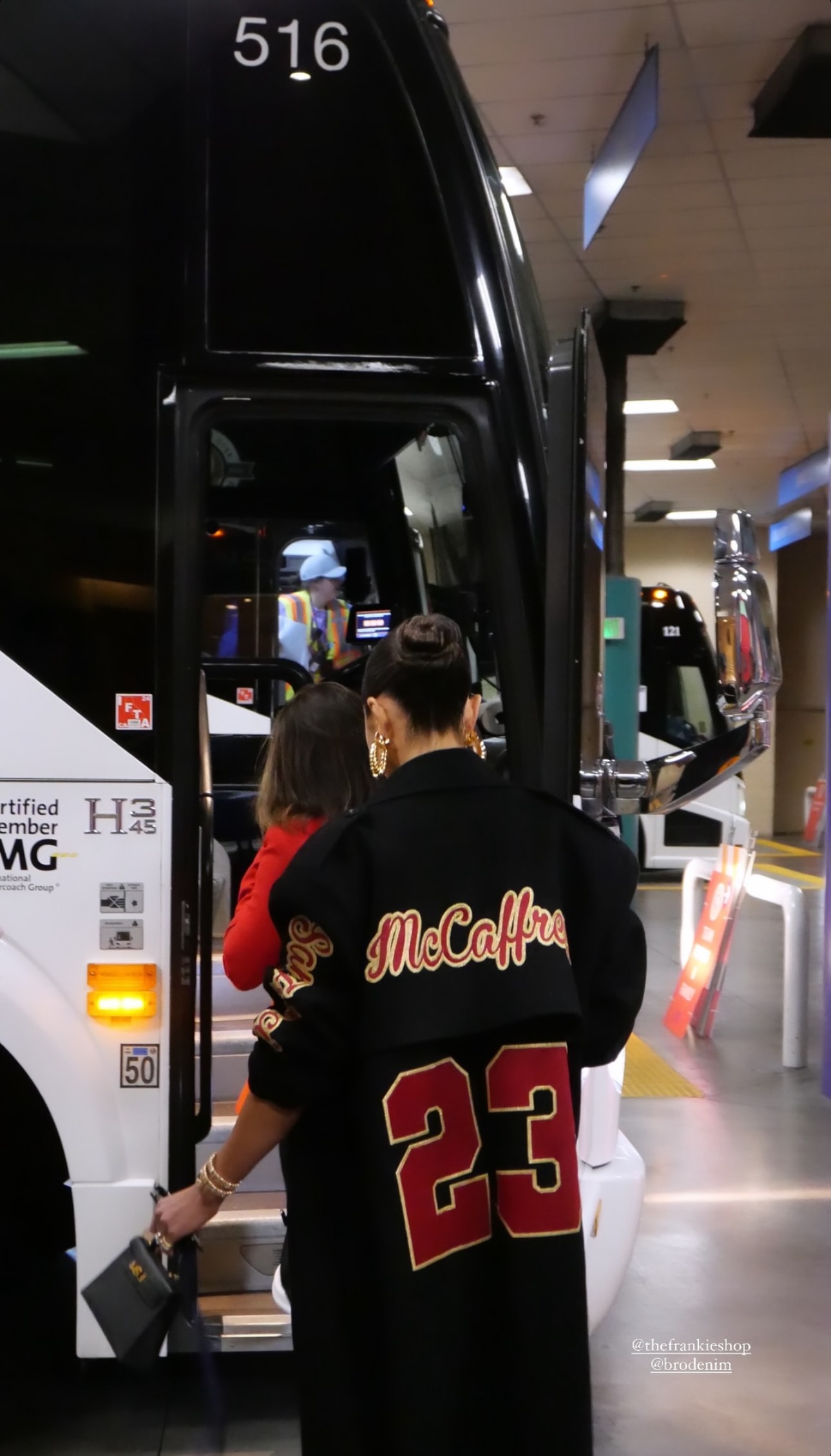 Olivia Culpo shows her support for NFL player boyfriend Christian McCaffrey at the Super Bowl LVIII with a custom The Frankie Shop coat with McCaffrey's name and jersey number embroidered on the back on February 11, 2024