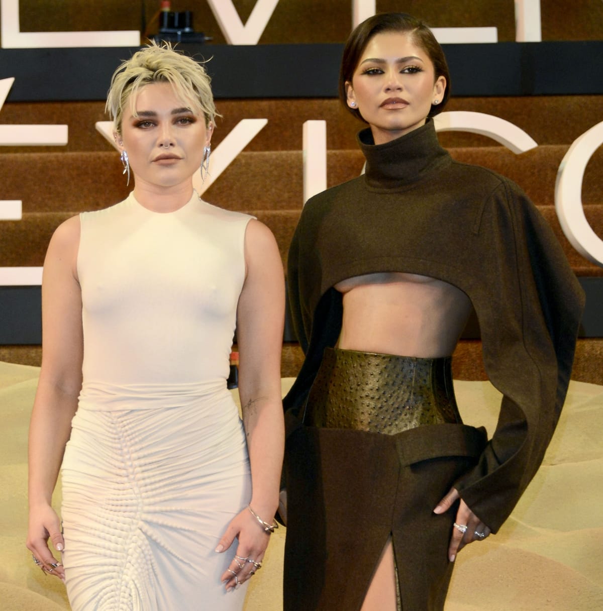 Zendaya's impeccable style shines through with Bulgari diamond jewelry, adding a touch of sophistication to her premiere look as she poses with Florence Pugh