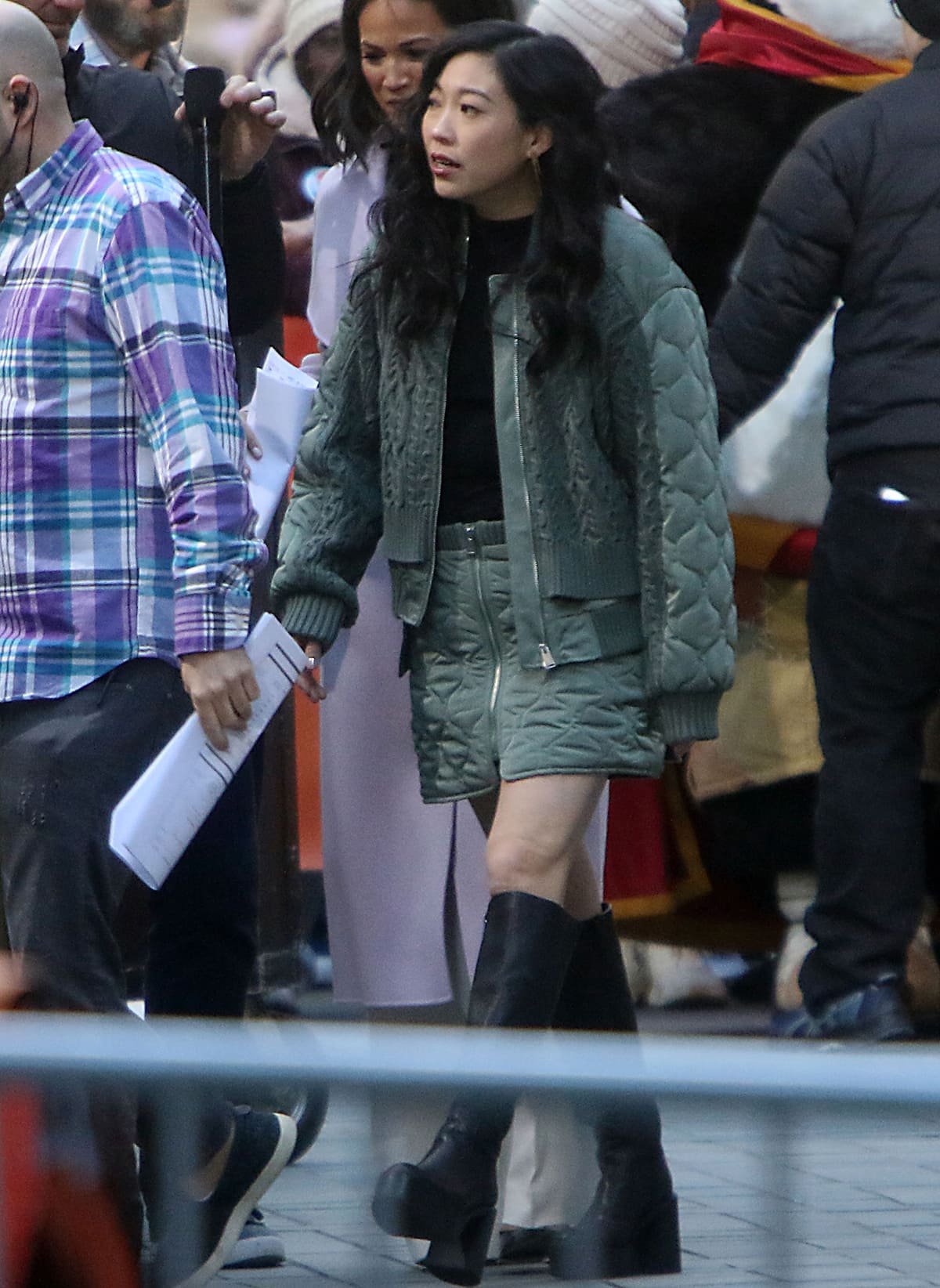 Awkwafina looks cool and chic in a green quilted and cable-knit bomber jacket and a matching mini skirt by Simkhai for her Today Show appearance on March 8, 2024