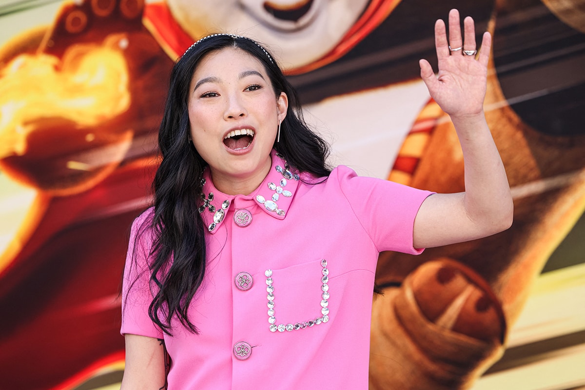 Awkwafina coordinates her glam with her dress, wearing soft pink makeup and a gorgeous wavy hairstyle