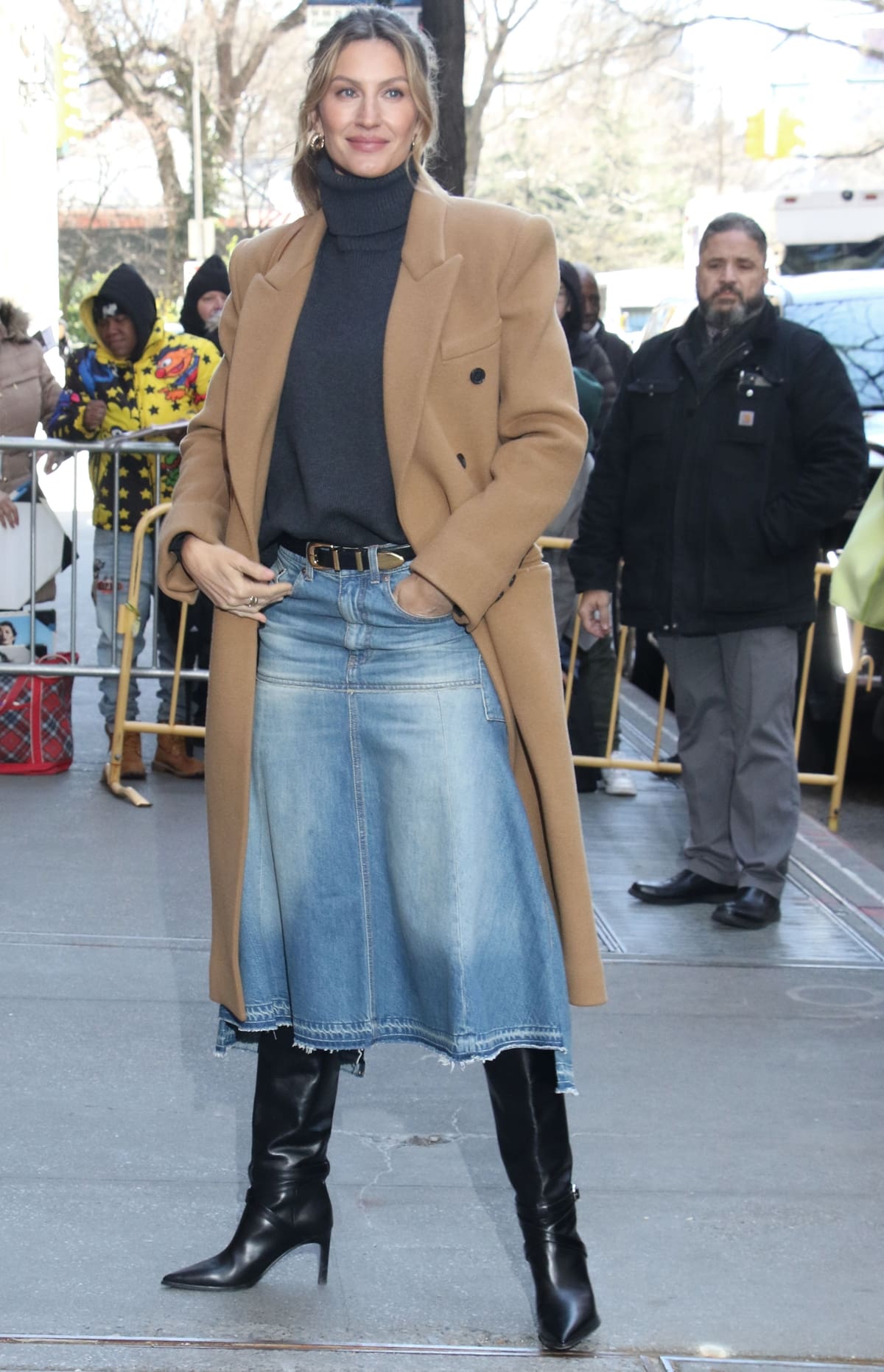 Gisele Bündchen breathes new life into the denim skirt, pairing a Victoria Beckham creation with knee-high Celine boots for an unexpected twist