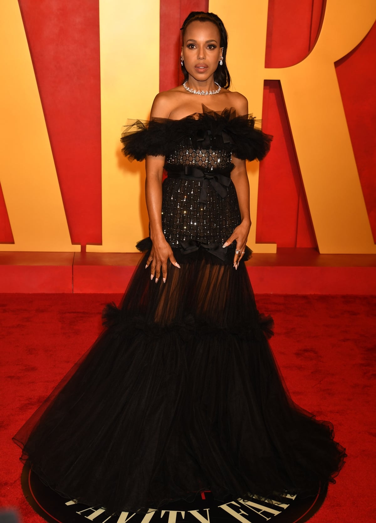 The dramatic flair of Kerry Washington's black Giambattista Valli gown at the 2024 Oscars Vanity Fair Party, a vision of sophistication