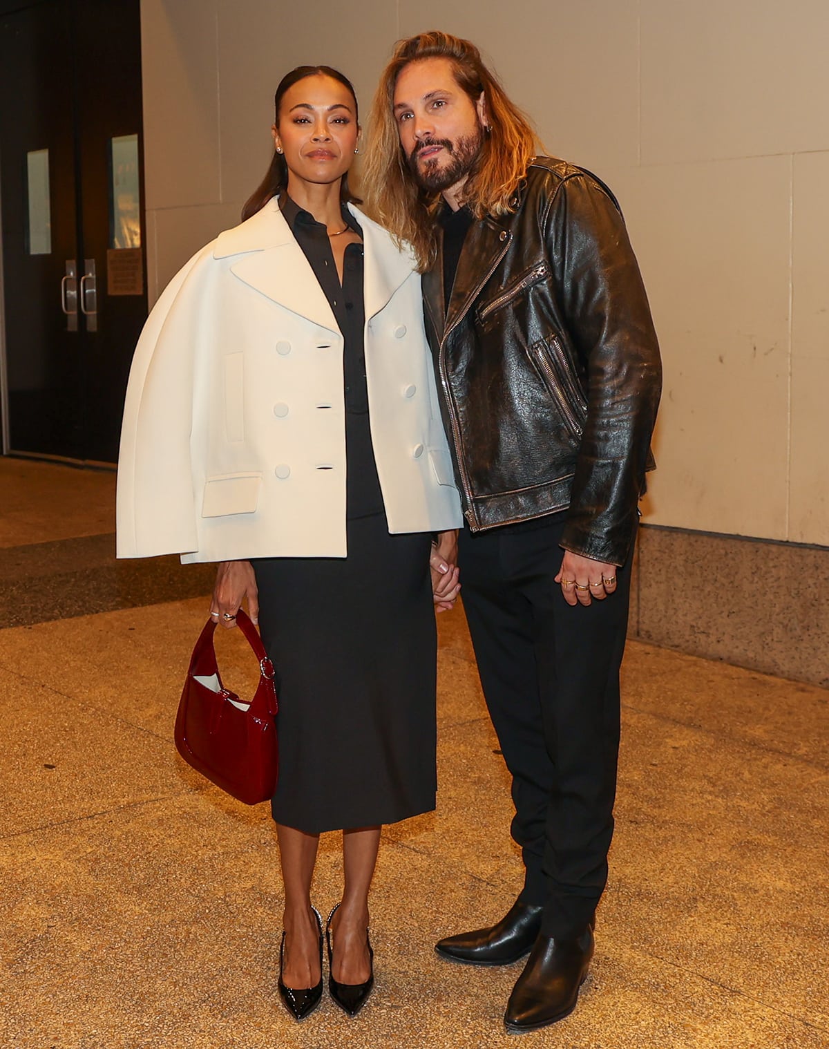 Zoe Saldaña with Marco Perego at The View studios to discuss The Absence of Eden dressed in a black Gucci shirt dress with a white Gucci jacket