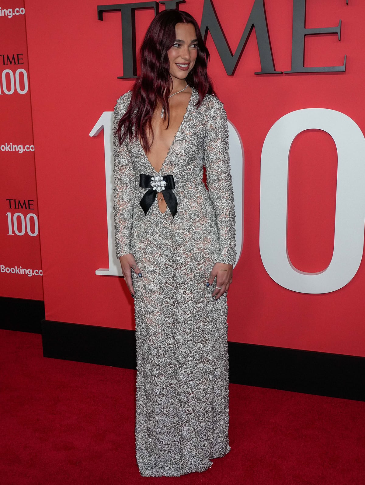 Taking inspiration from Jane Birkin's 1969 Emilio Pucci dress, Dua Lipa wears a custom white floral guipure lace gown by Chanel embellished with aluminum rings and crystals