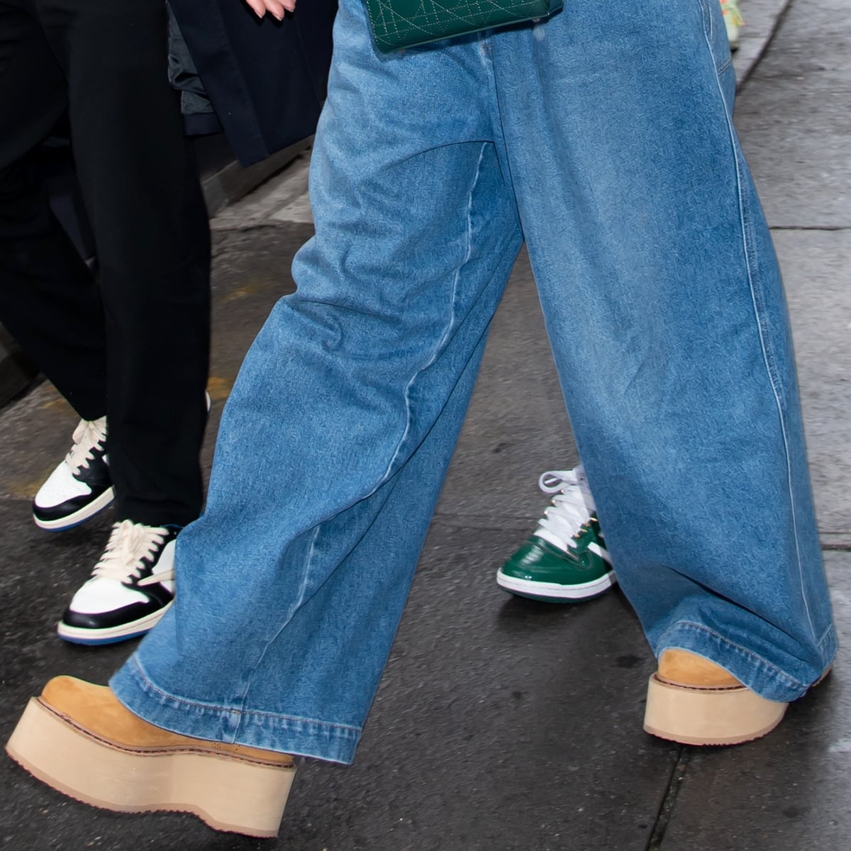 Jennifer Lopez rocks street-style perfection with her high-waisted Gucci jeans and cozy UGG boots during a casual Manhattan outing