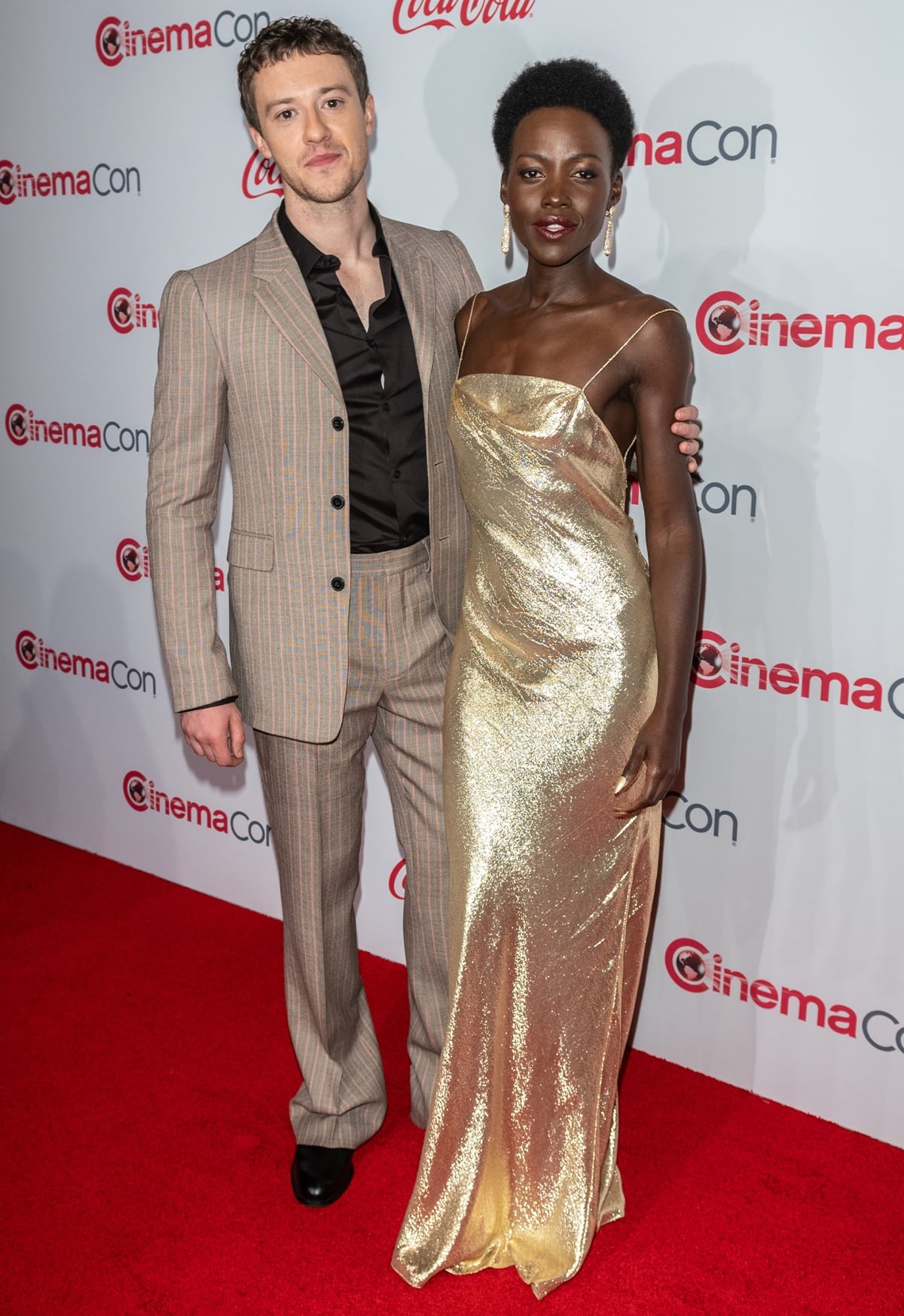 On the red carpet, Lupita Nyong'o, in her high heels, appears almost as tall as Joseph Quinn, despite their height difference, with her at 5ft 3 ¾ inches (161.9 cm) and him at 5ft 10 ¼ inches (178.4 cm)