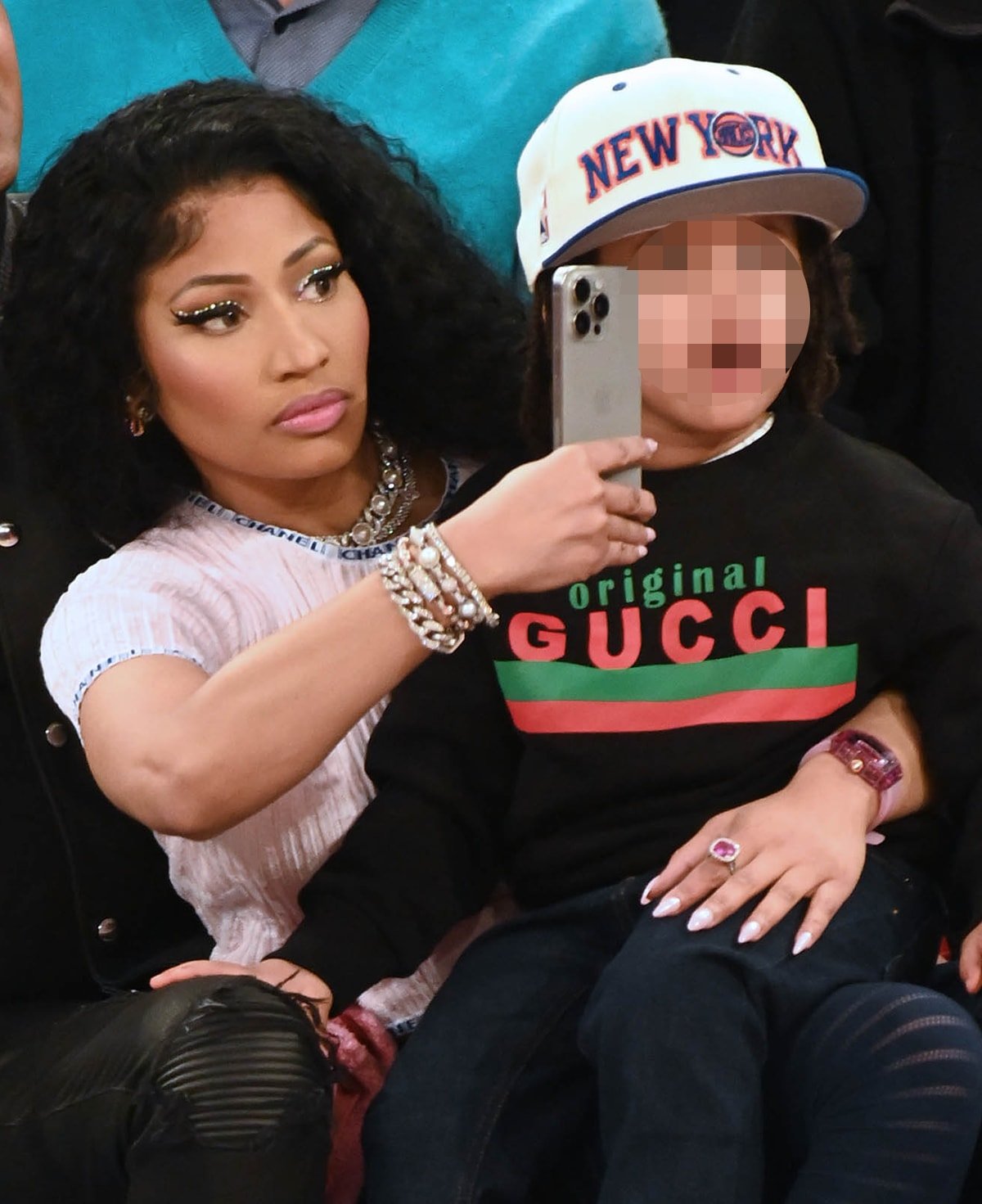 Nicki Minaj adds bling to her comfy casual courtside outfit with pearl and diamond jewelry by Chanel and the luxurious Richard Mille RM 07-02 Pink Lady Sapphire watch