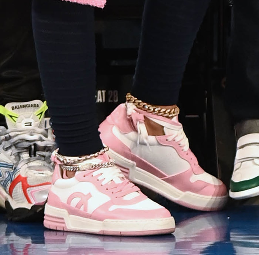 Nicki Minaj wears white-and-pink sneakers from her upcoming shoe collection with British vegan sneaker and apparel label Loci