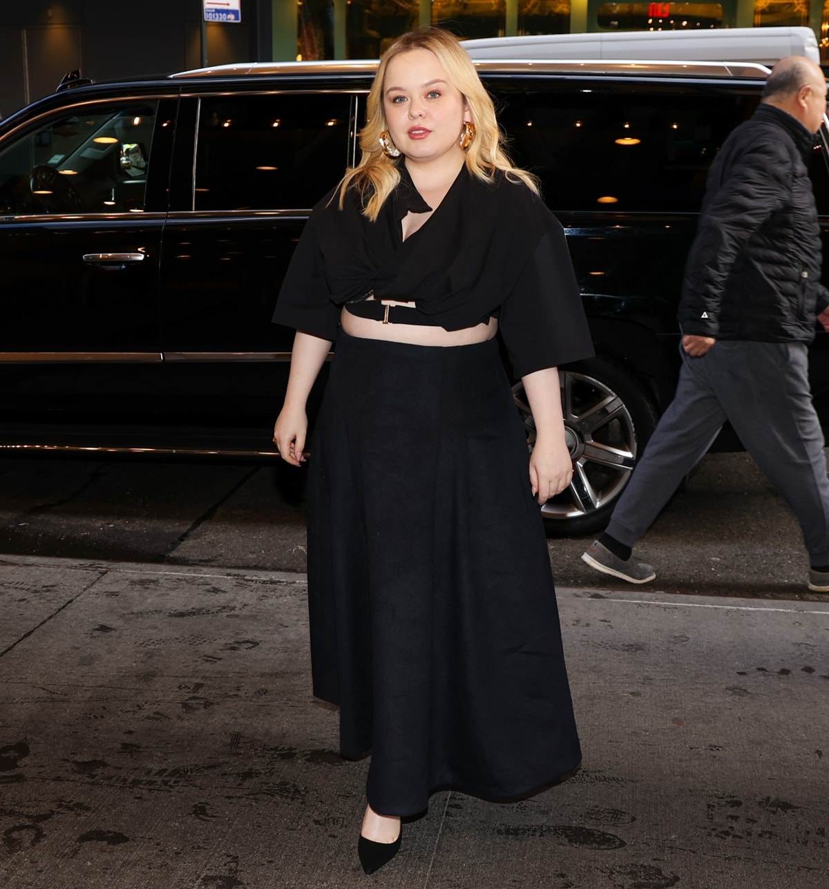 Effortlessly chic: Nicola Coughlan pairs a black crop top with a maxi skirt for a sleek appearance on CBS Mornings