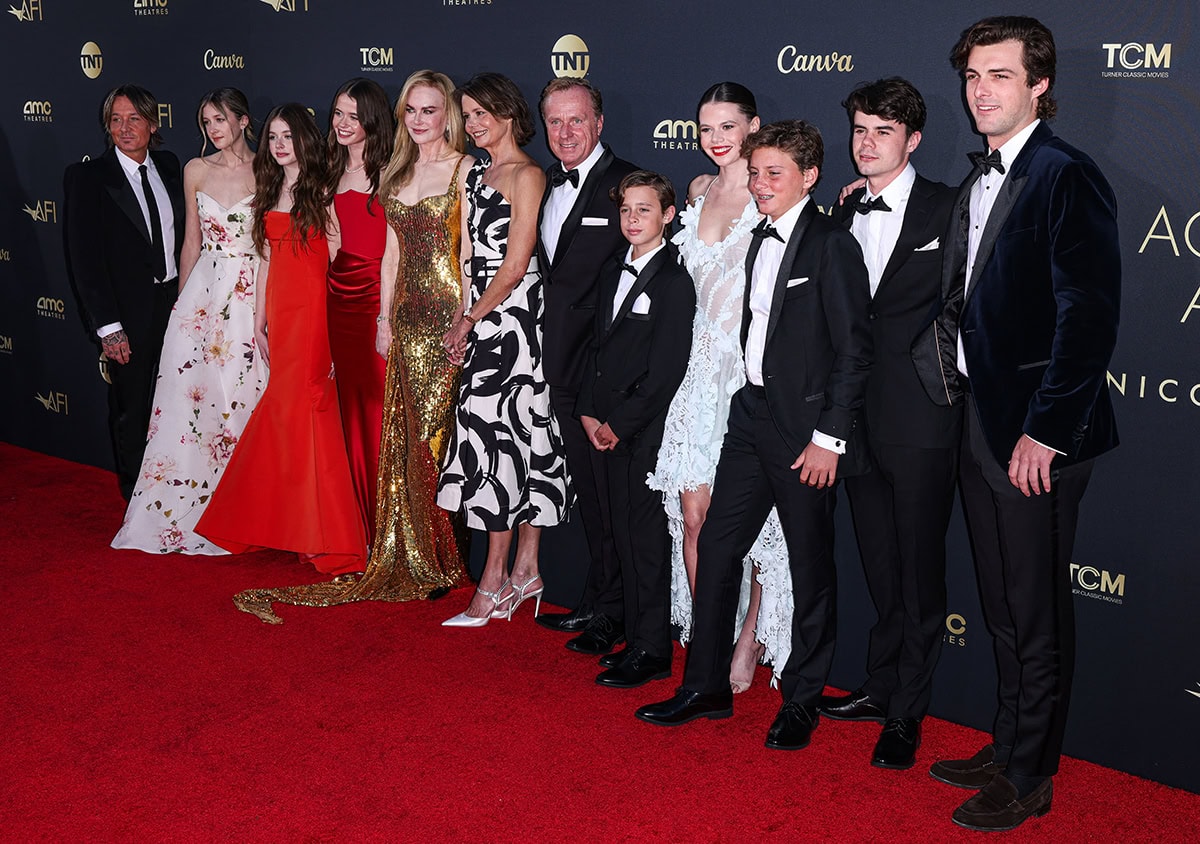 Nicole Kidman is joined by her family, including her husband Keith Urban, and their daughters, Sunday and Faith, who are both wearing Monique Lhuillier gowns, at the 49th AFI Life Achievement Award ceremony at The Dolby Theater on April 27, 2024