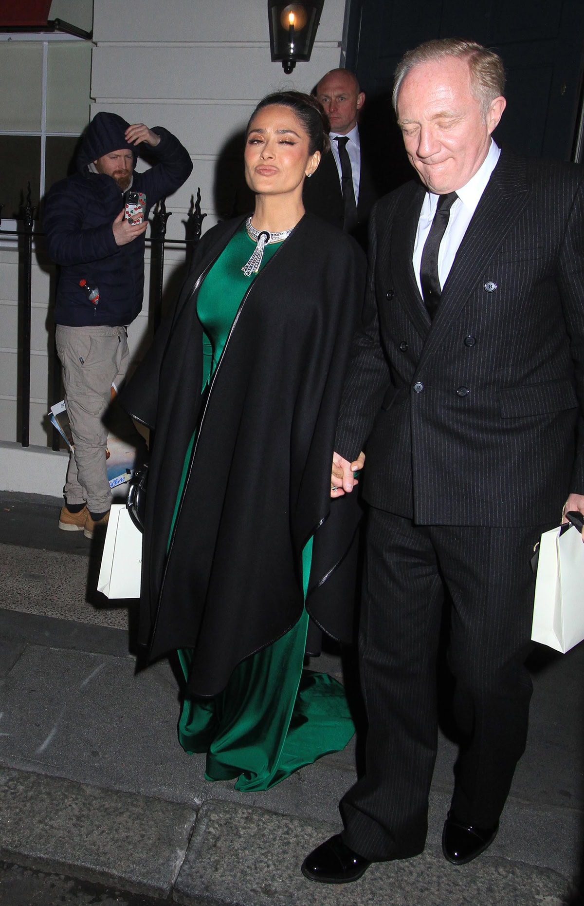 Salma Hayek looks regal in her emerald-green Victoria Beckham gown styled with a statement Boucheron diamond necklace at Victoria Beckham's birthday party