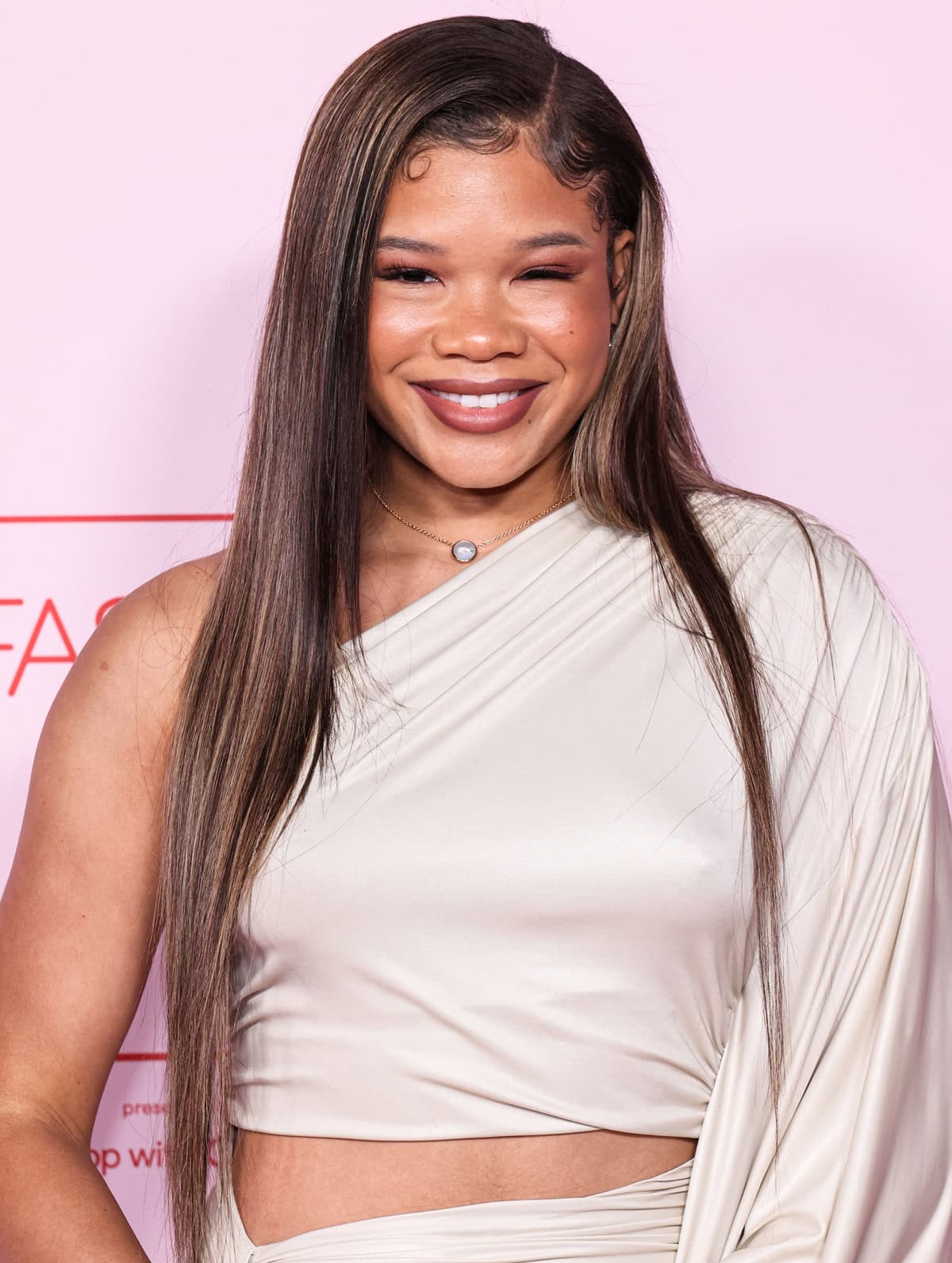 Storm Reid adorned herself with a striking gold Pomellato Pom Pom Dot necklace, adding a glamorous focal point to her outfit