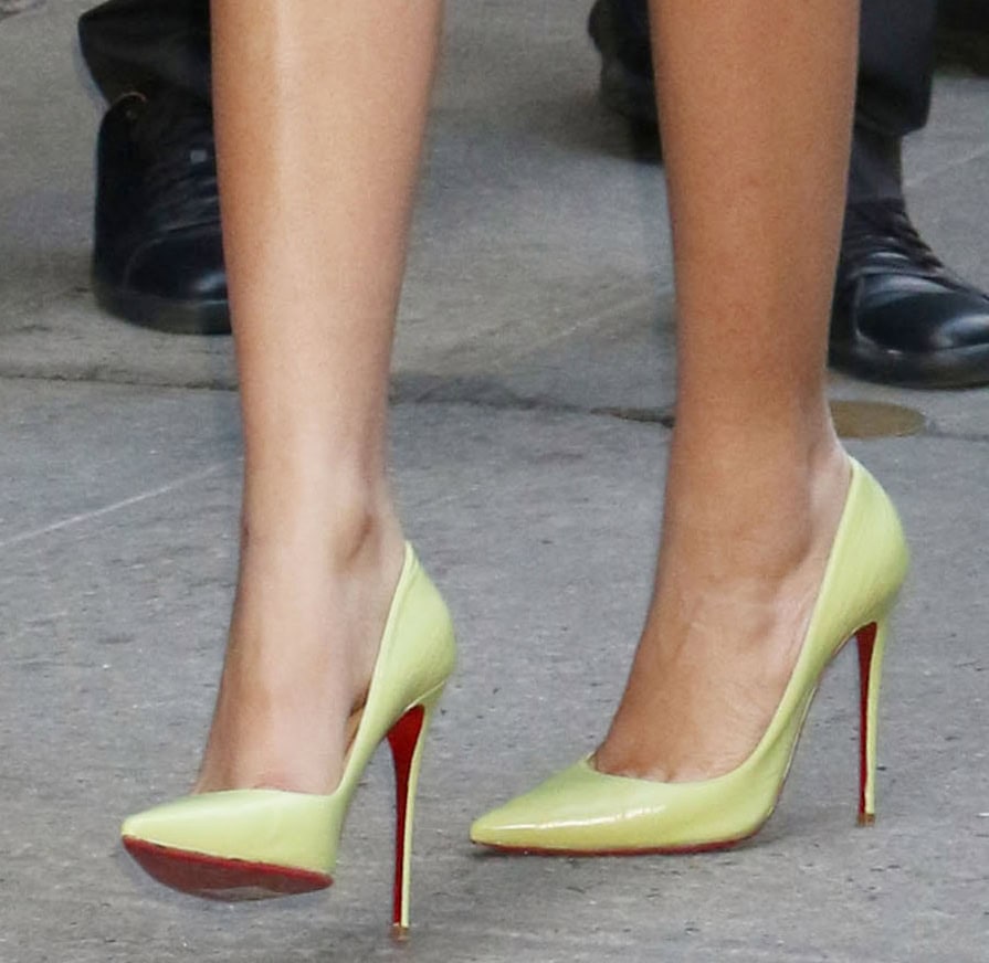 Zendaya pairs her lime green plunging skirt suit with green Christian Louboutin So Kate pumps