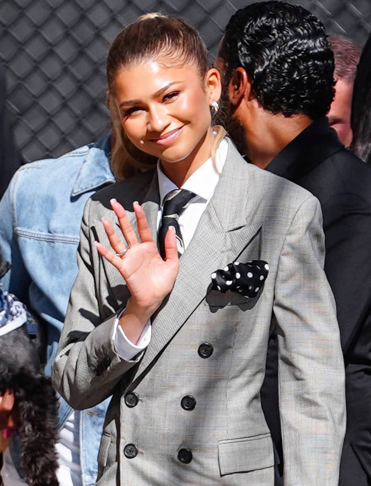 Zendaya wears warm makeup and styles her honey-blonde locks in a ponytail