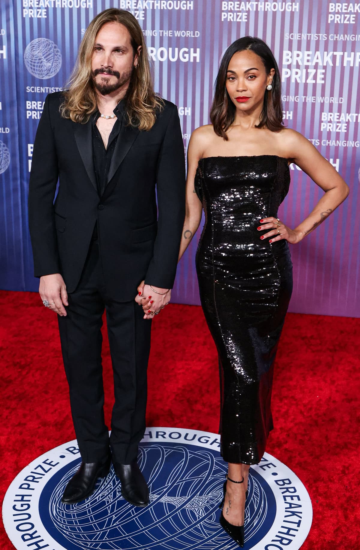 Zoe Saldaña, poised and elegant next to Marco Perego, attends the 10th Annual Breakthrough Prize Ceremony