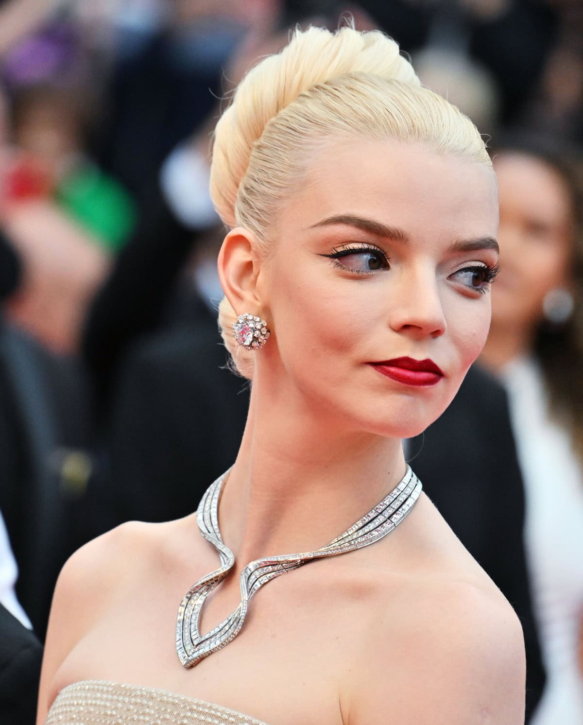 Anya Taylor-Joy's red carpet look was elevated by layers of Tiffany & Co. jewelry, including a dazzling diamond statement necklace and elegant platinum rings styled by Ryan Hastings