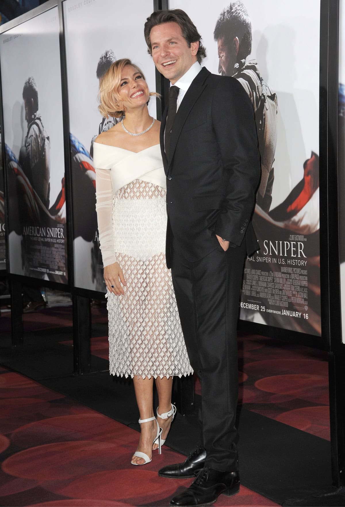 Sienna stunned in an off-shoulder Balenciaga dress paired with white Balenciaga sandals and Harry Winston jewels, while Bradley, at 6ft ½ in (184.2 cm), towered over her despite her heels