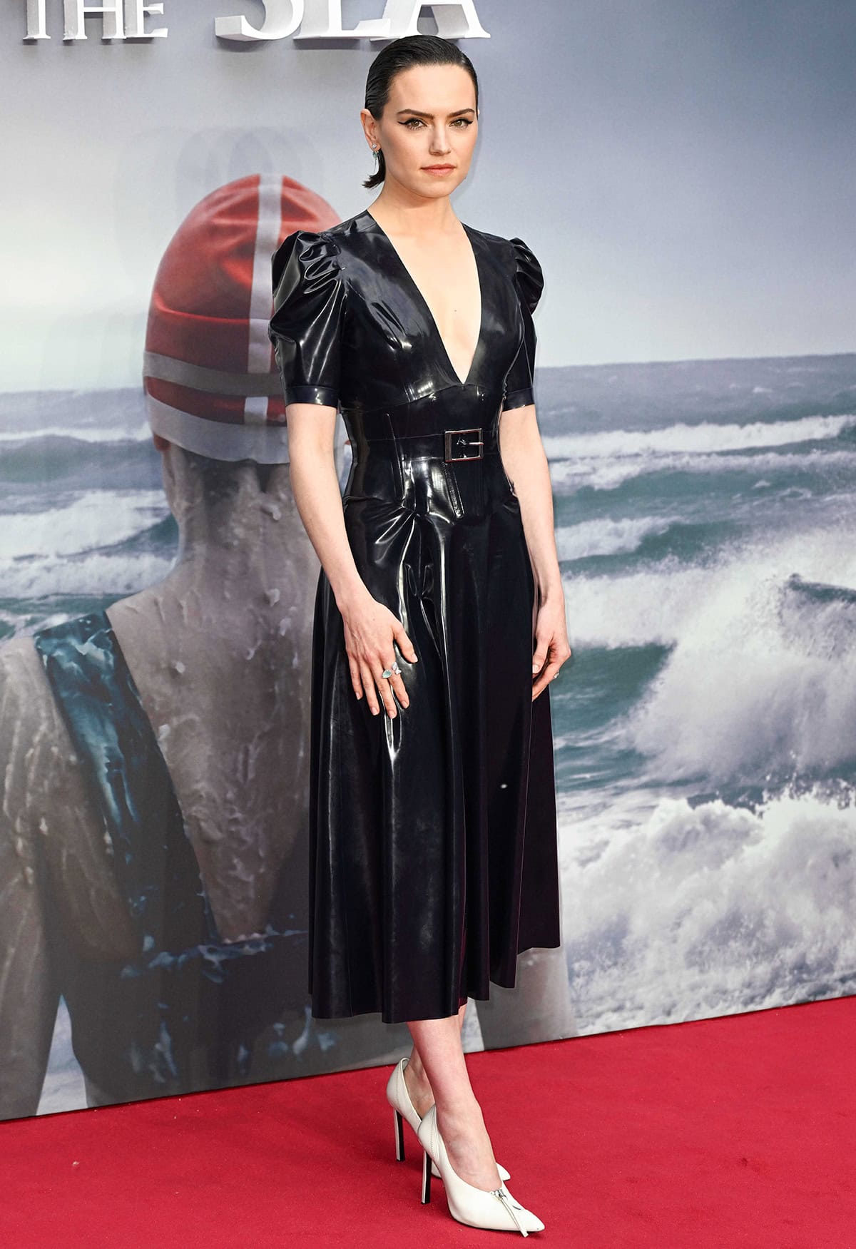 Daisy Ridley's Atsuko Kudo dress features a daring plunging neckline and a built-in waspie corset with feminine puff sleeves and midi skirt