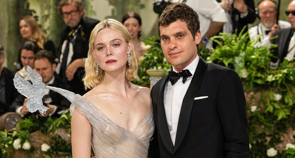 Sleeping Beauty Awakens: Elle Fanning Exudes Romantic Elegance in Enchanting Balmain Transparent Gown at 2024 Met Gala