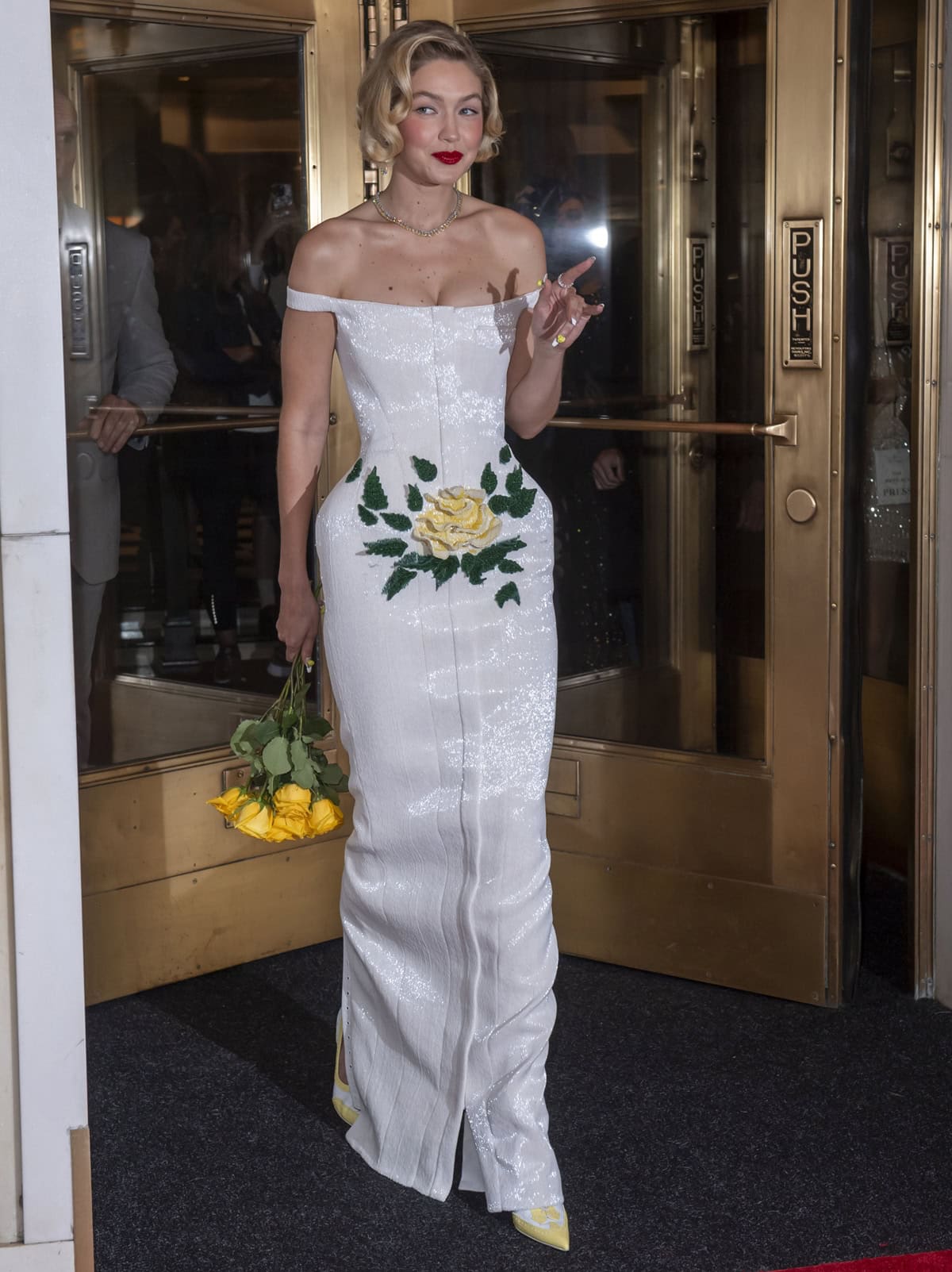 Subtle yet stunning: Gigi Hadid's elegant Thom Browne pumps peek out from under her voluminous Met Gala gown, adding a hint of color and sophistication