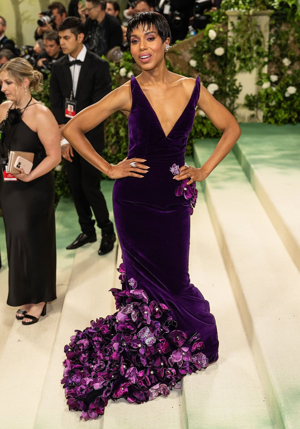Kerry Washington looks blooming in a purple velvet gown adorned with over 600 hand-cut satin and velvet orchids by Oscar de la Renta at the 2024 Met Gala