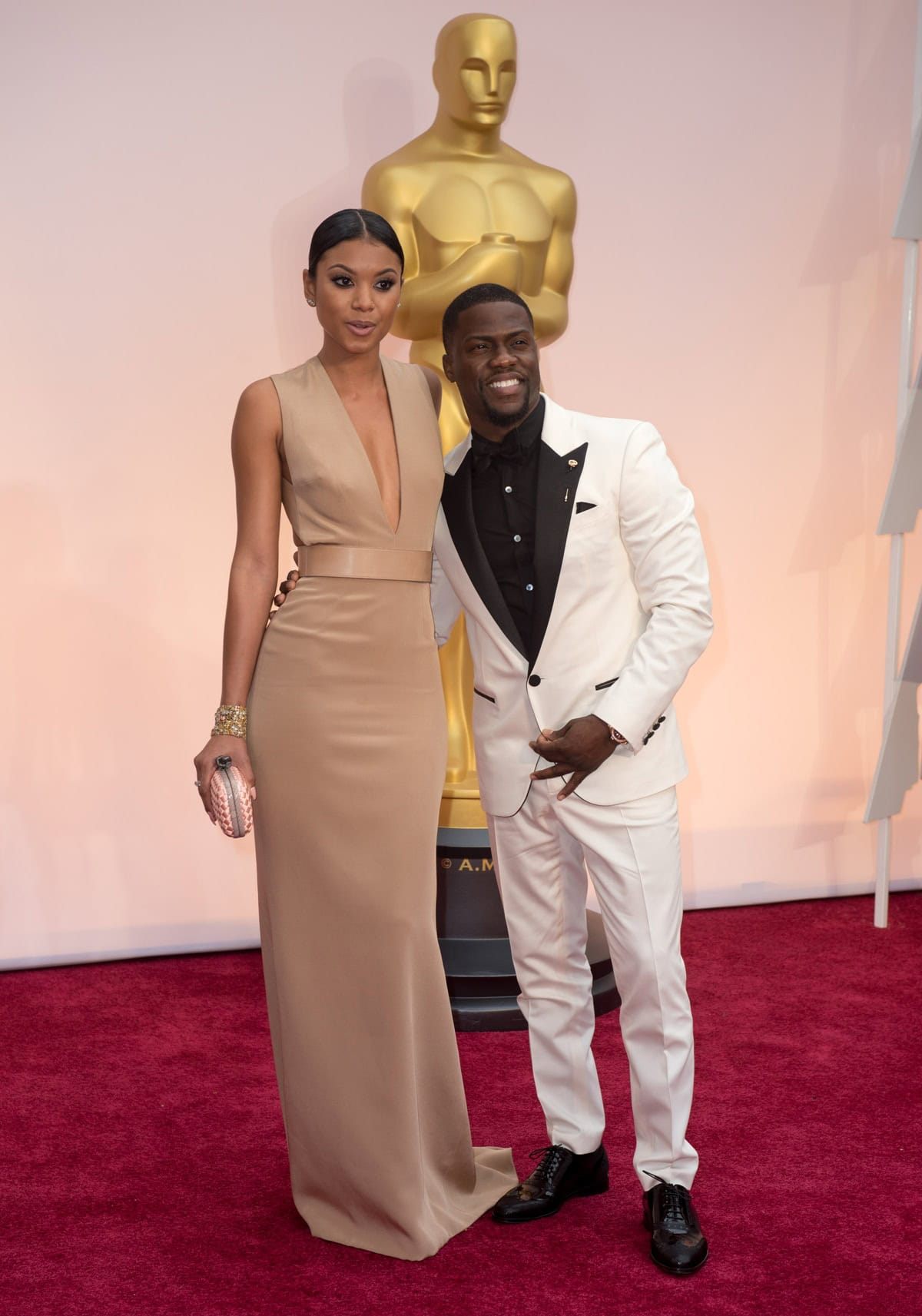 Kevin Hart and fiancée Eniko Parrish attend the 87th Annual Academy Awards at the Dolby Theatre in Hollywood, California, on February 22, 2015