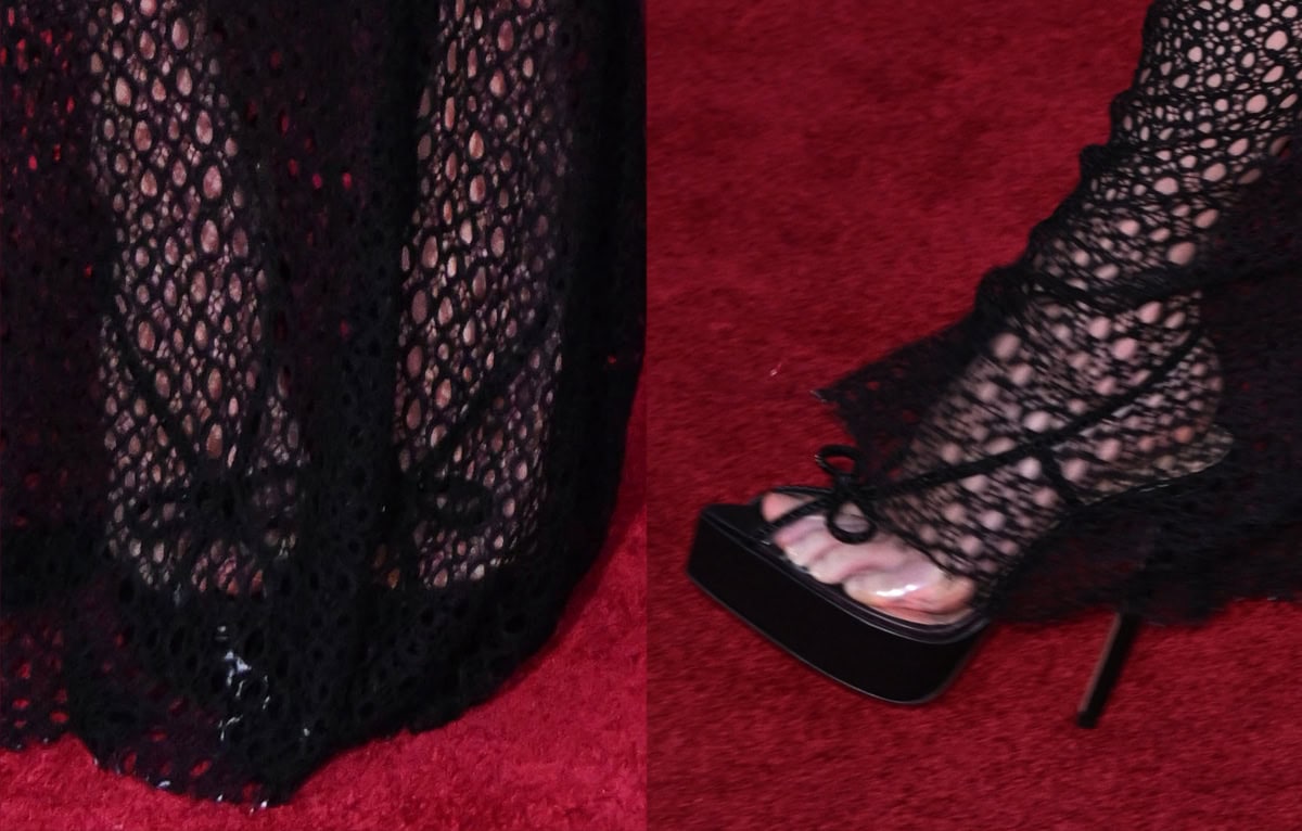 Leni Klum pairs her black mesh gown with black platform heels adorned with a bow and fastened to her ankles with slingback straps
