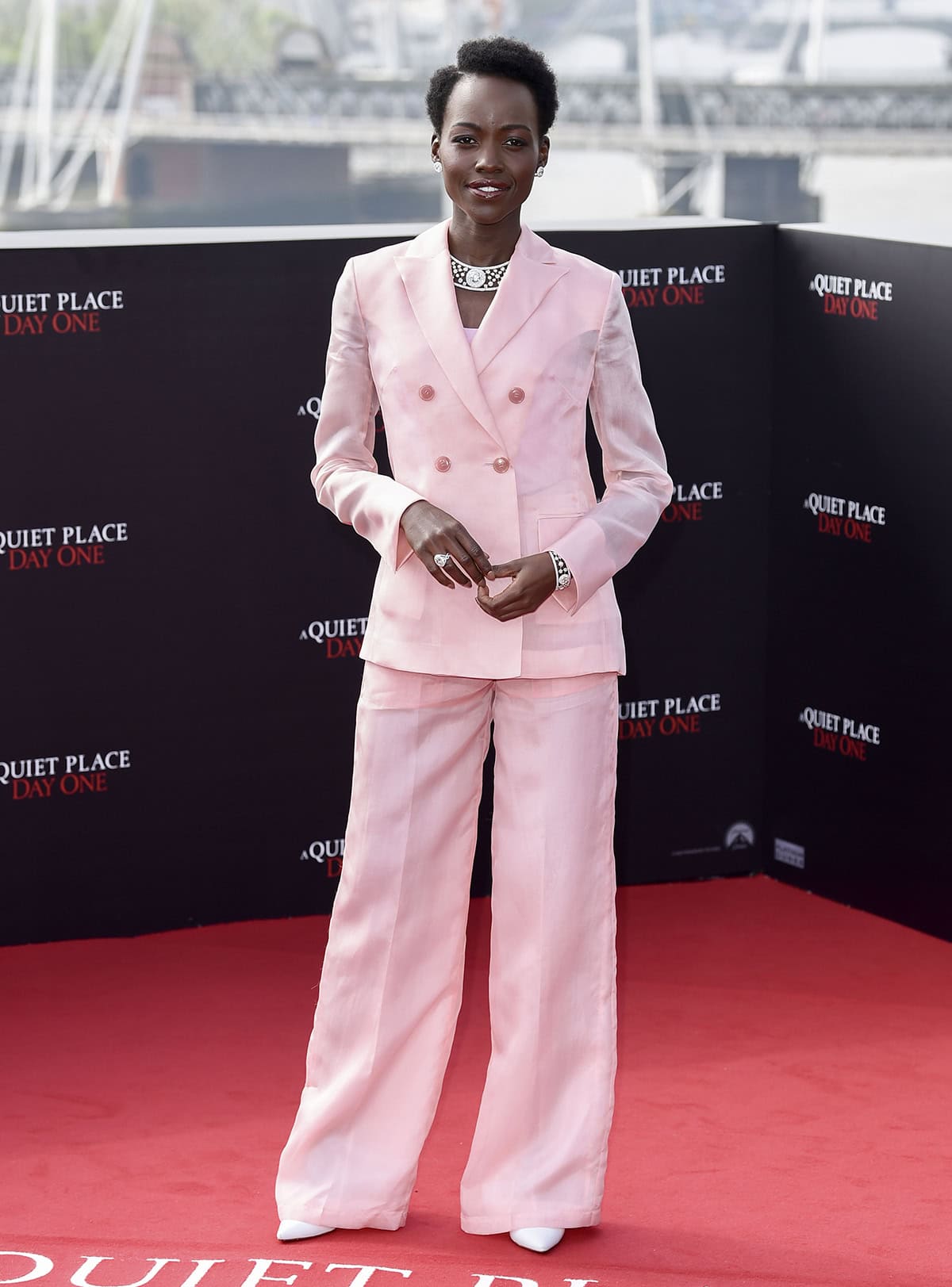 Lupita Nyong'o exudes a girl-boss vibe in her pink semi-sheer co-ord suit by Swiss fashion brand Akris