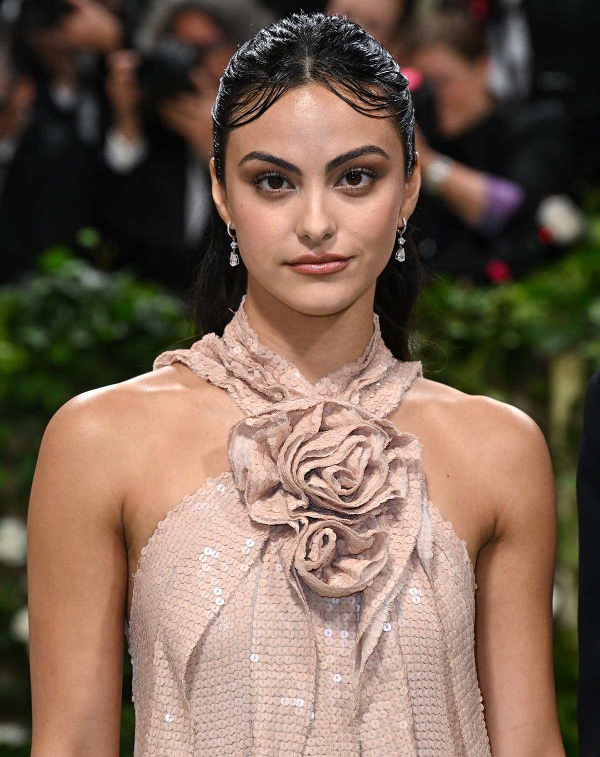 Mendes embraced "The Garden of Time" dress code in a Joseph Altuzarra creation. Her outfit featured a romantic ruffled halter dress adorned with a dramatic rosette at the neckline, perfectly capturing the event's essence and showcasing her flair for blending elegance and glamour