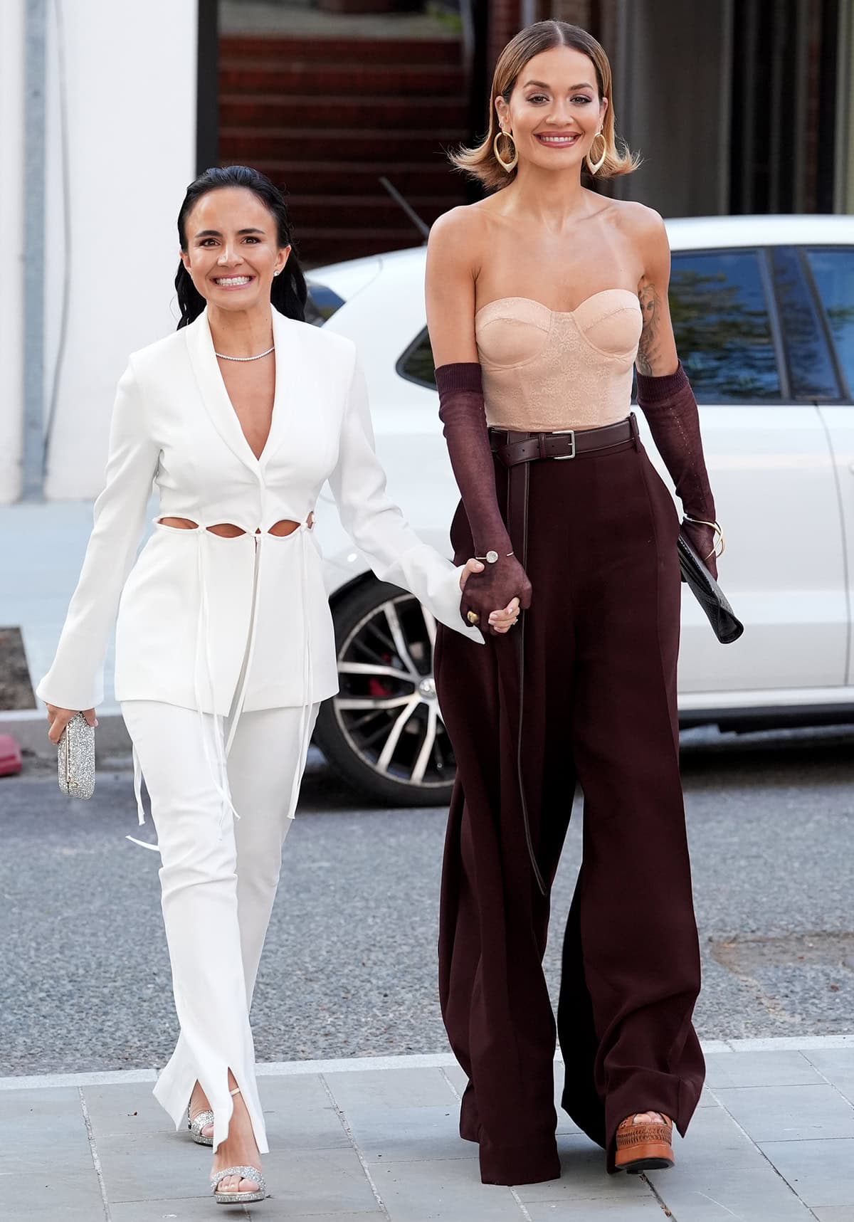Anna Lahey, Vida Glow founder, arrives at the event with her Typebea co-founder Rita Ora in a white cutout suit