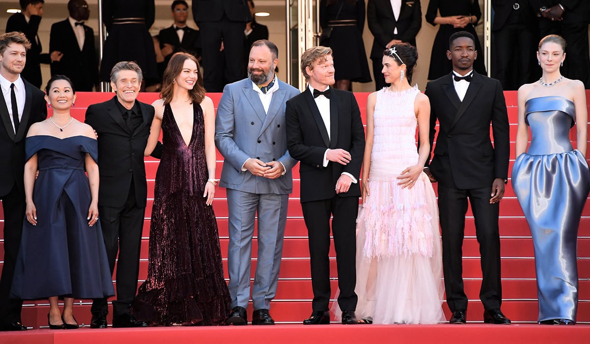 Director Yorgos Lanthimos with the cast of Kinds of Kindness at the Cannes Film Festival premiere of their new movie