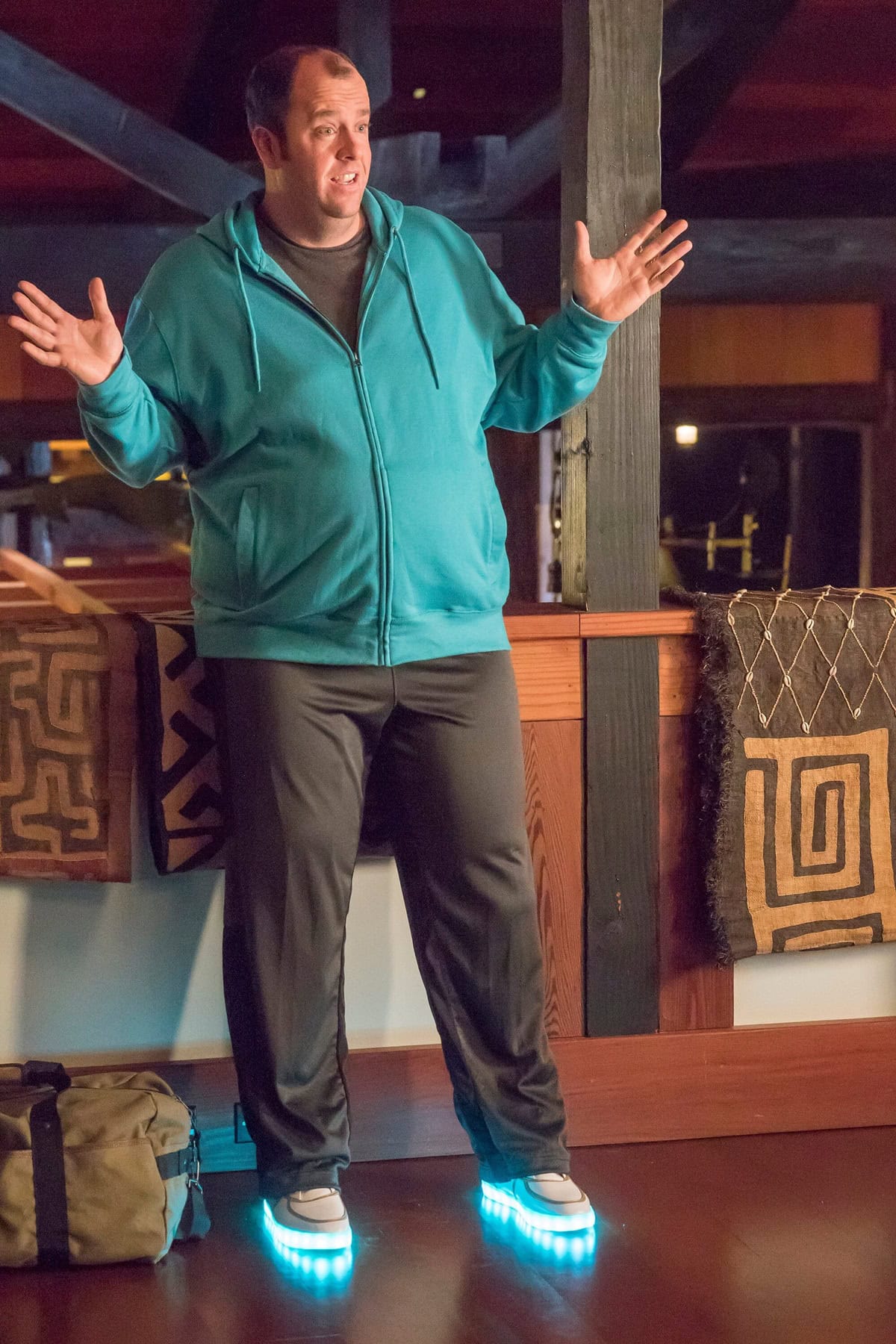 Chris Sullivan as Toby Damon in This Is Us Episode 1x14, bringing comic relief in a teal hoodie and track pants paired with glowing light-up sneakers that steal the scene
