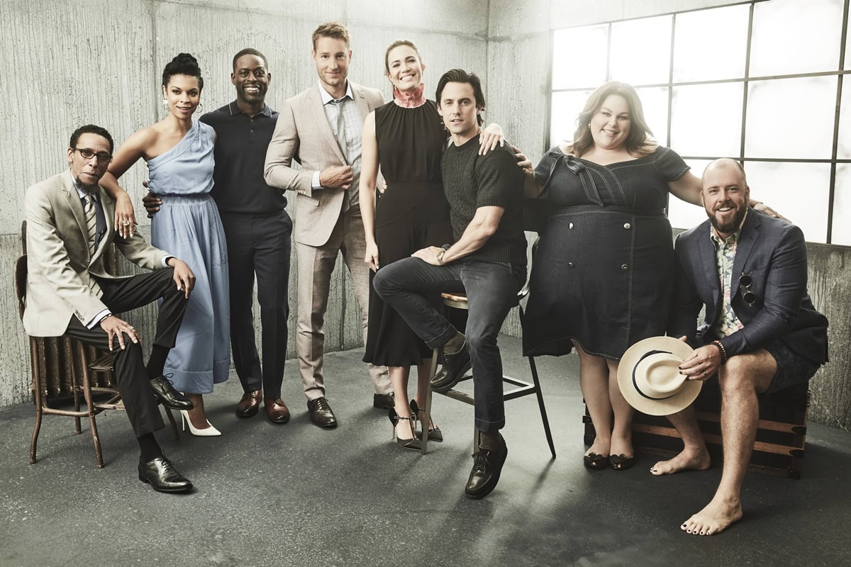 Ron Cephas Jones, dapper in a beige suit and glossy black dress shoes, anchors the This Is Us Season 2 cast promo alongside Susan Kelechi Watson, Sterling K. Brown, Justin Hartley, Mandy Moore, Milo Ventimiglia, Chrissy Metz, and Chris Sullivan