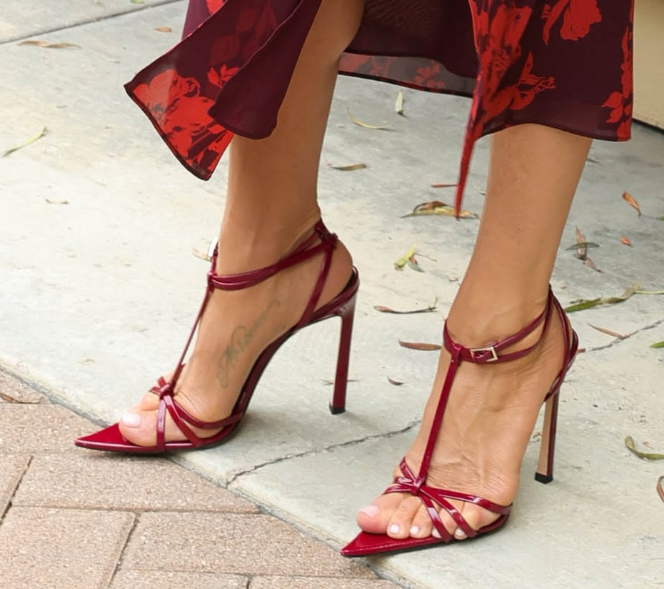 Jennifer Aniston teams her red dress with strappy T-strap heels with open pointed toes and high stiletto heels