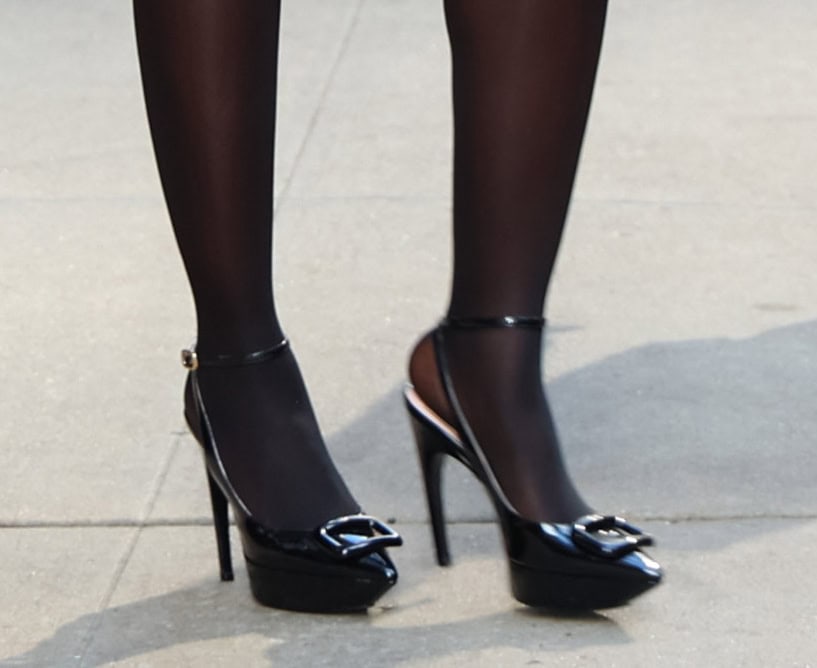 Jodie Turner-Smith teams her pink knickers with sheer black tights and Roger Vivier's Viv' Choc platform pumps