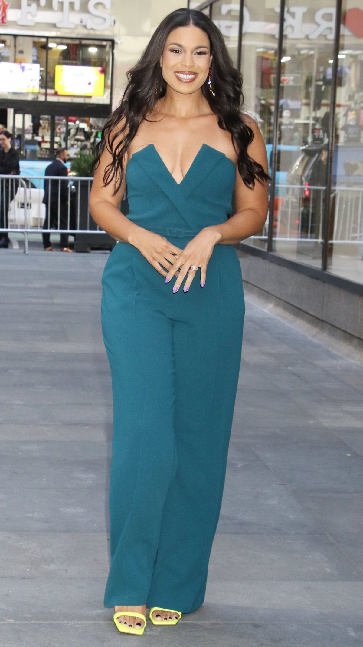 Jordin Sparks turns heads in a teal plunging jumpsuit paired with bold yellow square-toe heels as she arrives at The Today Show in New York City on October 10, 2024